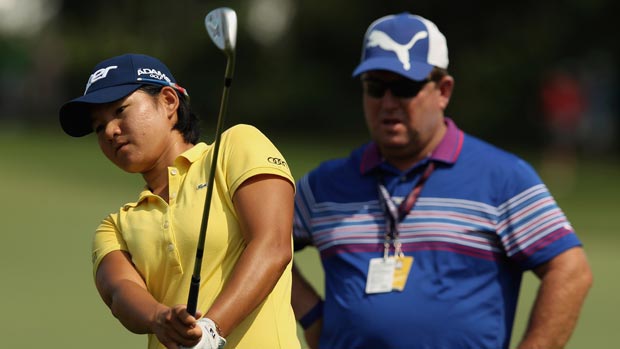 Yani Tseng and Gary Gilchrist during a practice round prior to the start of the 2012 U.S. Women's Open
