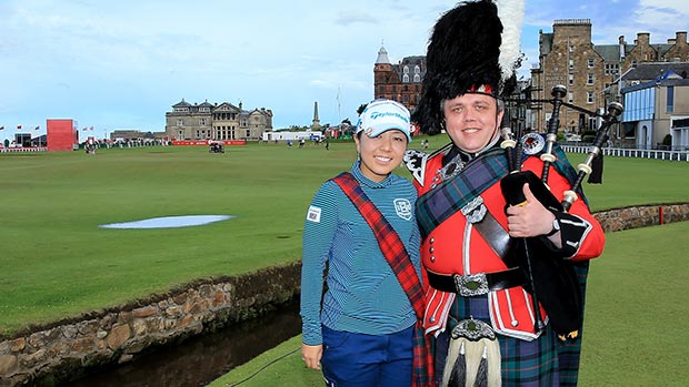 Mika Miyazato poses with a piper on the 18th hole as a preview for the 2013 Ricoh Women's British Open