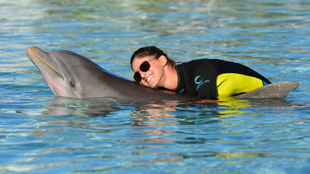 Belen Mozo and Michelle Wie swim with the dolphins