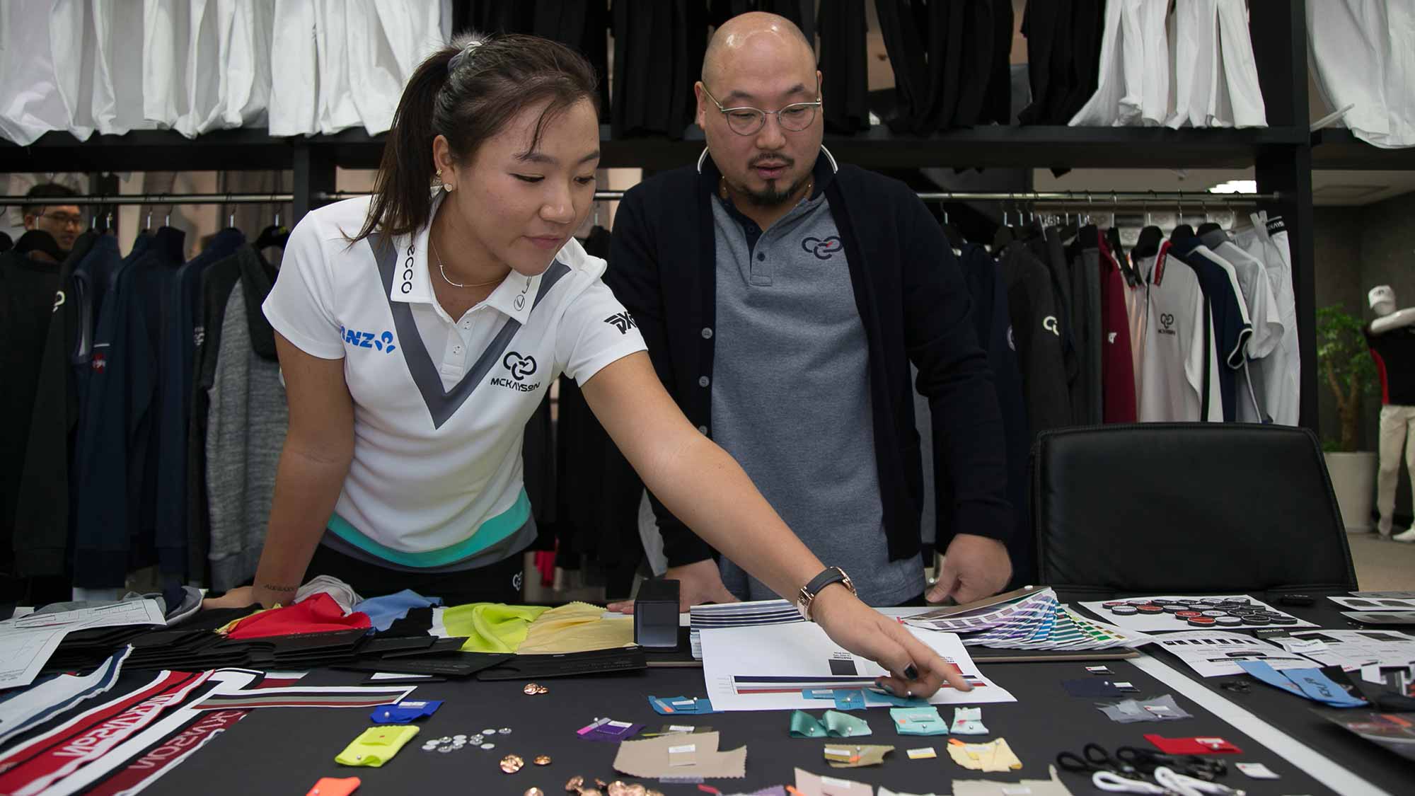 Lydia Ko visits MCKAYSON's Offices in Korea on December 28 to compare swatches for her new apparel line.