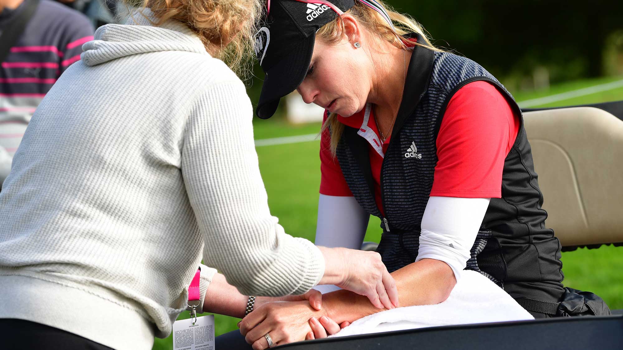 Paula Creamer of USA gets physio treatment for her sprained wrist during the weather delayed first round of The Evian Championship at Evian Resort Golf Club on September 15, 2017 in Evian-les-Bains, France.