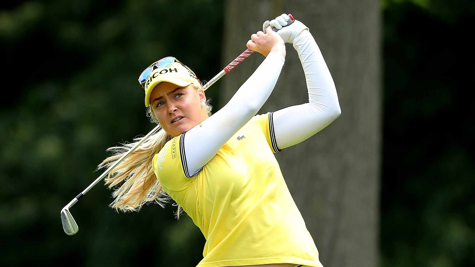 Charley Hull of England hits an approach shot during a Pro-Am round ahead of the Ricoh Women's British Open