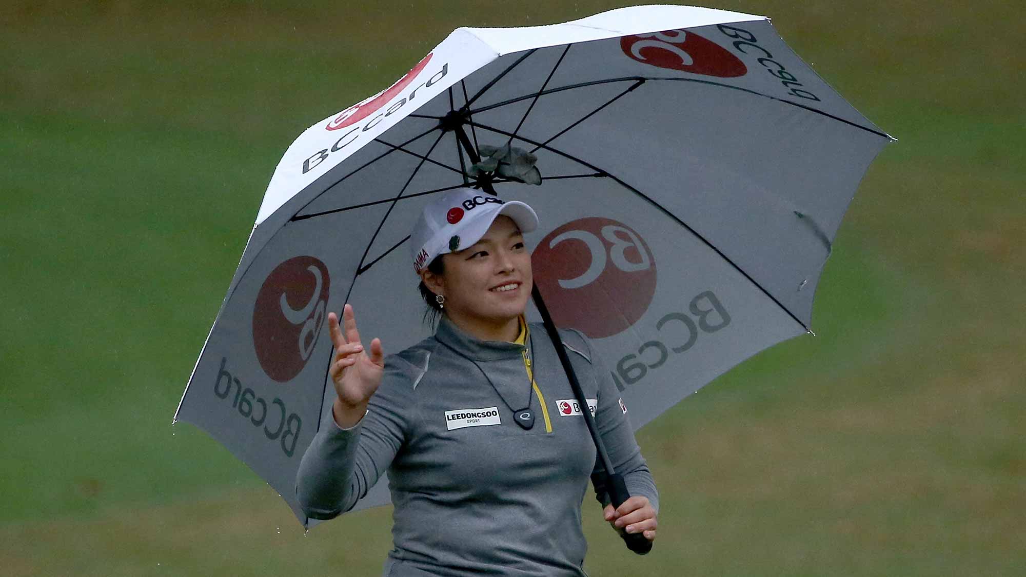Ha Na Jang of South Korea acknowledges the crowd on the 18th hole during the final round of the Coates Golf Championship Presented By R+L Carriers at Golden Ocala Golf Club