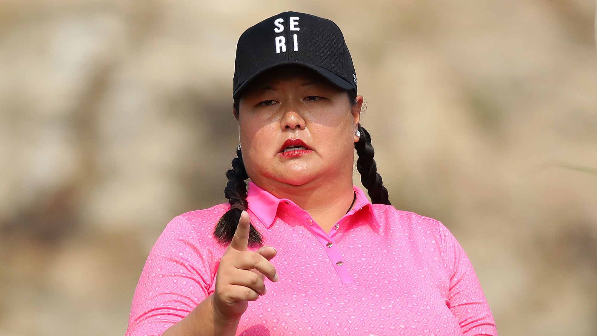 Christina Kim of United States wear Se-Ri Pak's hat on the 2nd hole during the second round of the LPGA KEB-Hana Bank Championship at the Sky 72 Golf Club Ocean Course