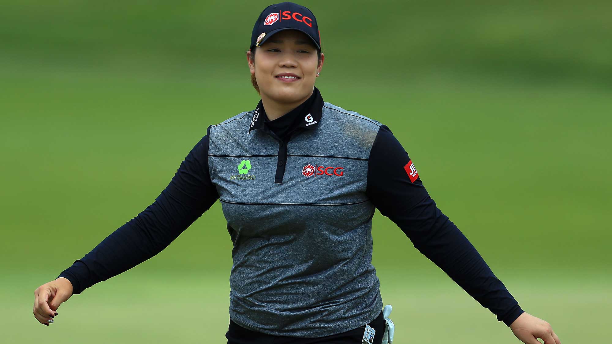 Ariya Jutanugarn of Thailand smiles after sinking her putt on the 1st green during the final round of the Manulife LPGA Classic