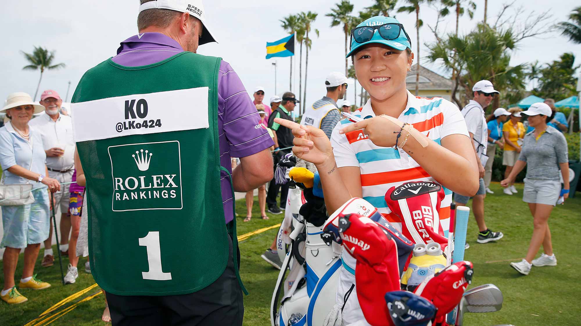 Lydia Ko of New Zealand reacts after her caddie was presented with the Rolex World Rankings number one caddie bib 