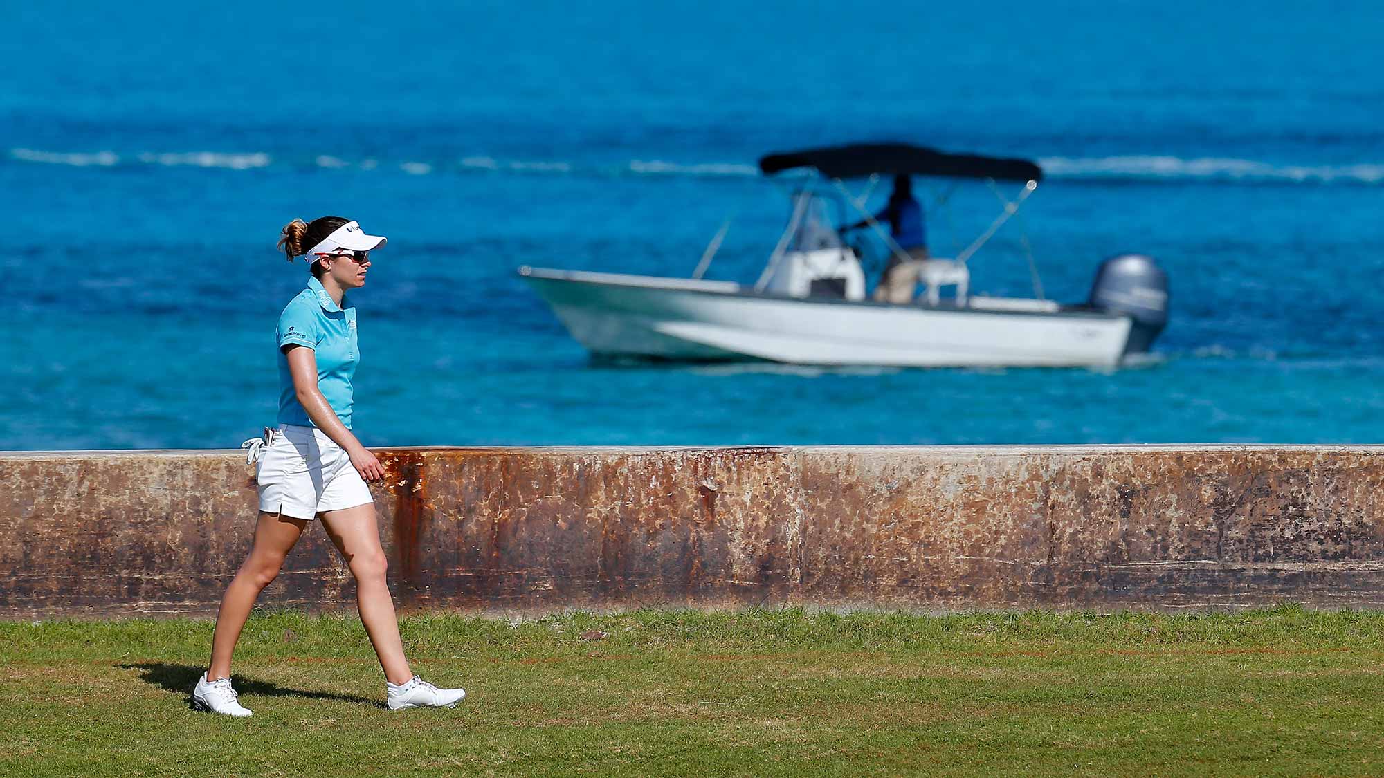 Gaby Lopez of Mexico walks down the eighth hole during the first round of the Pure Silk Bahamas LPGA Classic at the Ocean Club Golf Course