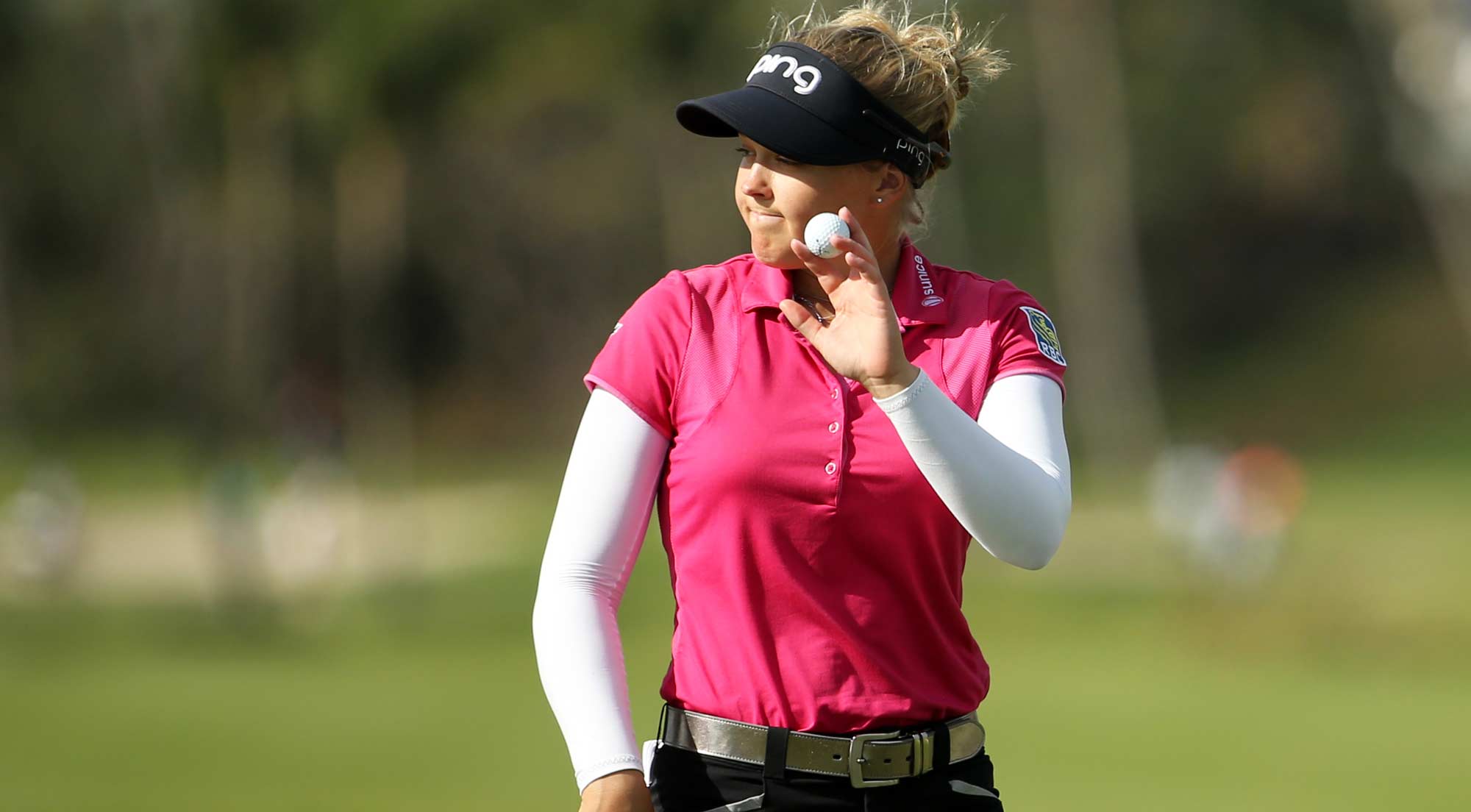 Brooke Henderson of Canada acknowledges the crowd on the eighth green during round one of the Pure Silk Bahamas LPGA Classic