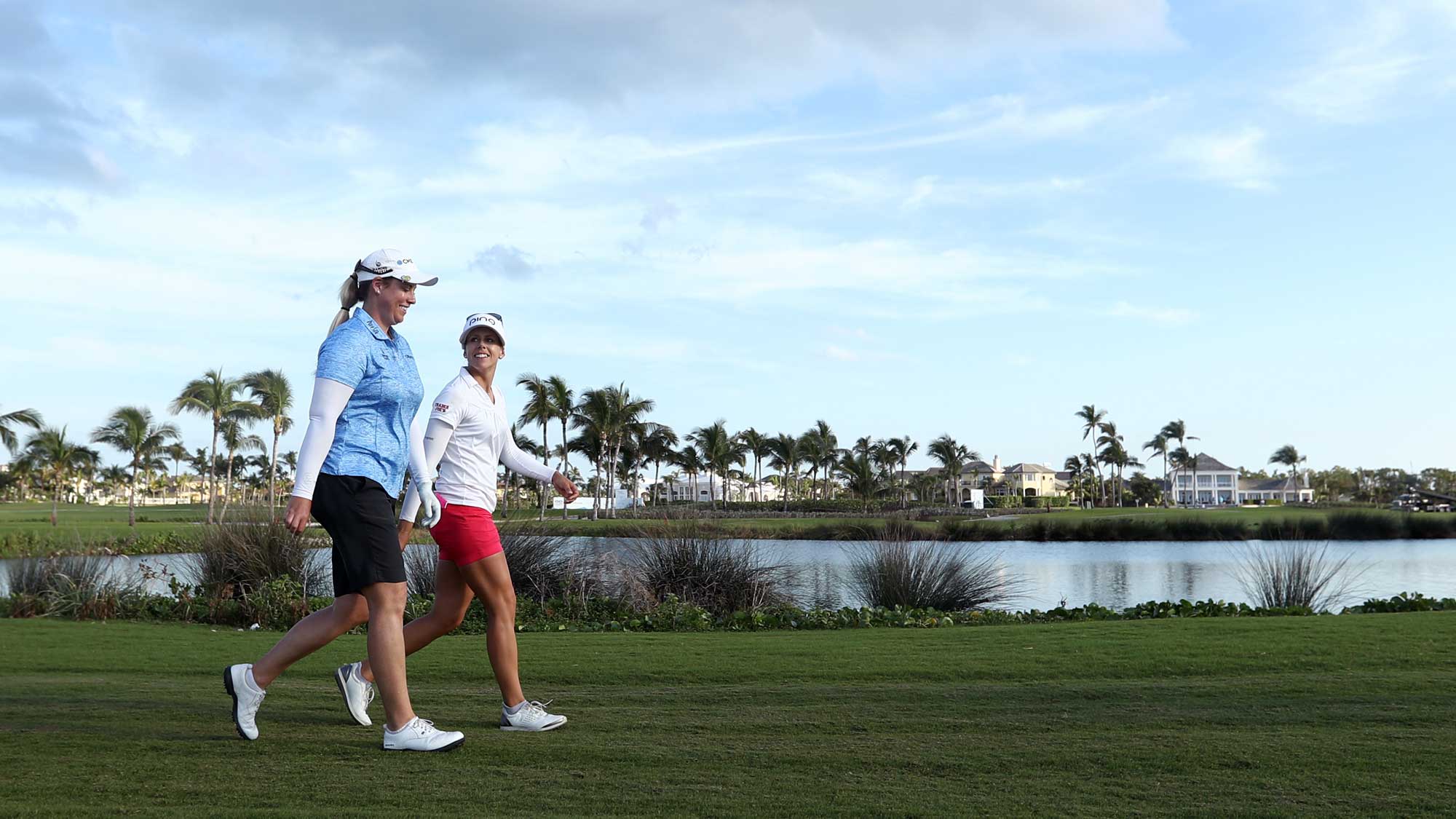 Brittany Lincicome of the United States and Pernilla Lindberg of Sweden walk on nine fairway during round two of the Pure Silk Bahamas LPGA Classic