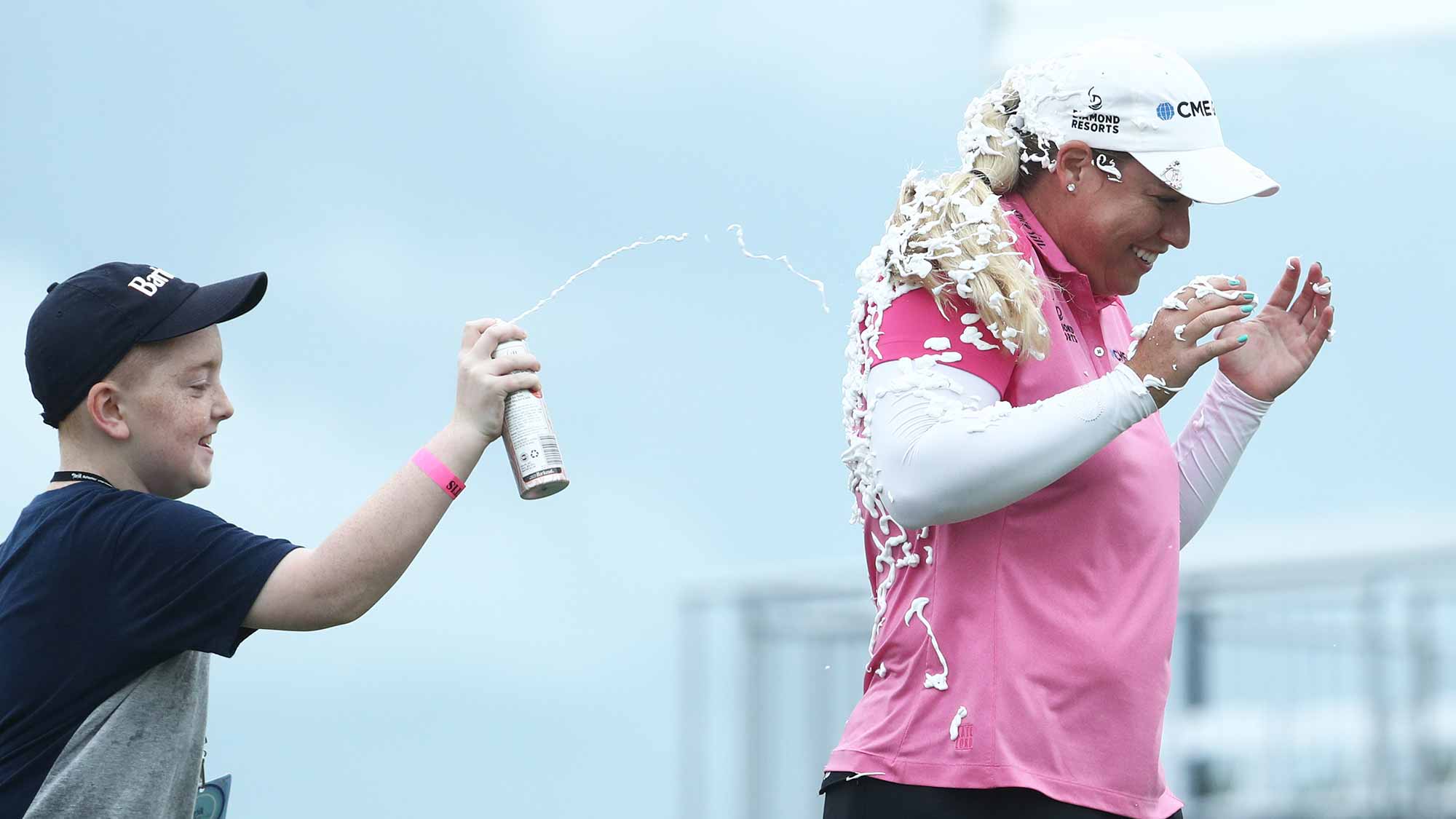 Brittany Lincicome of the United States is sprayed with PureSilk shaving cream after winning the Pure Silk Bahamas LPGA Classic