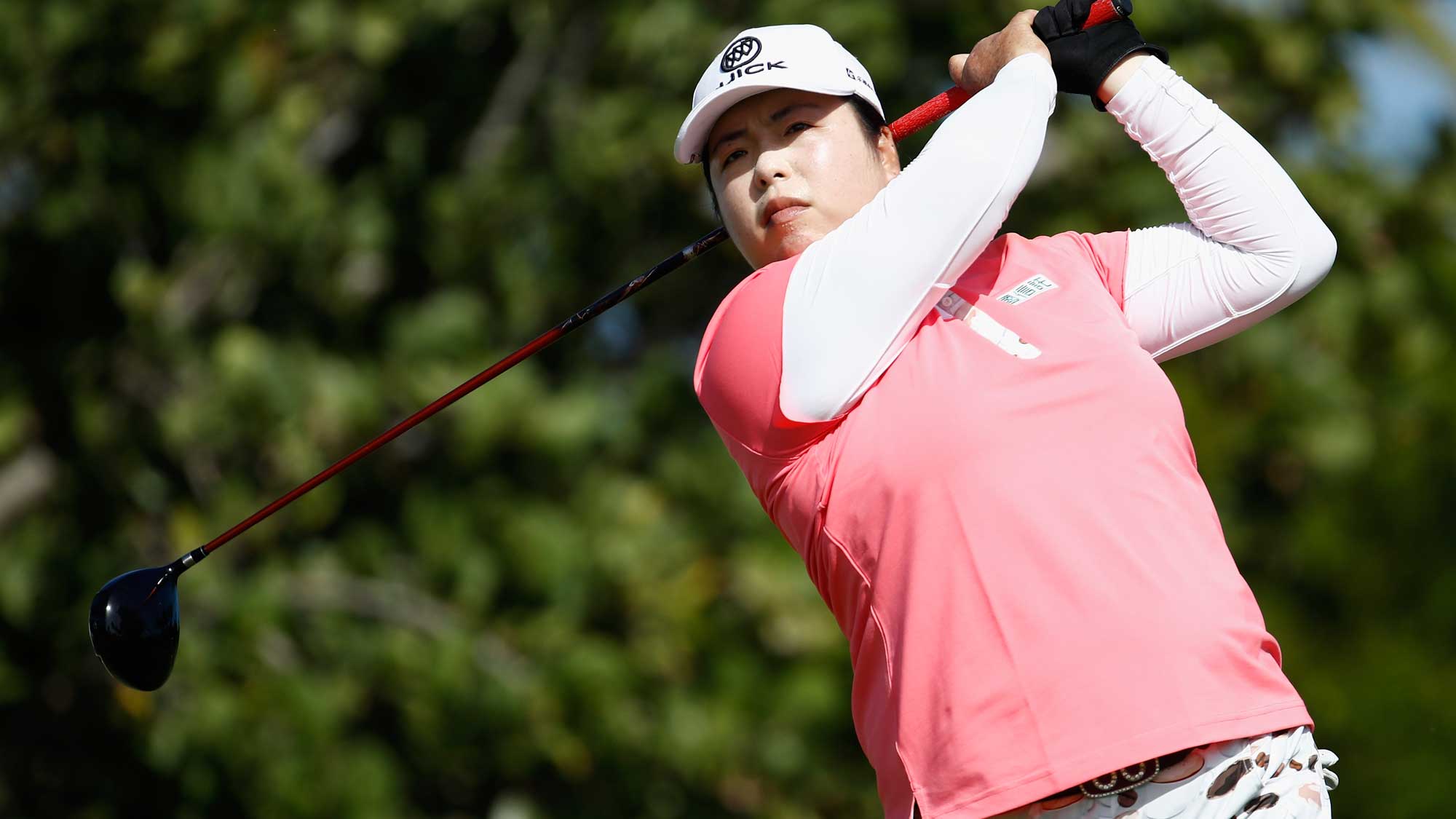 Shanshan Feng of China hits her tee shot on the 4th hole during the final round of the Pure Silk Bahamas LPGA Classic