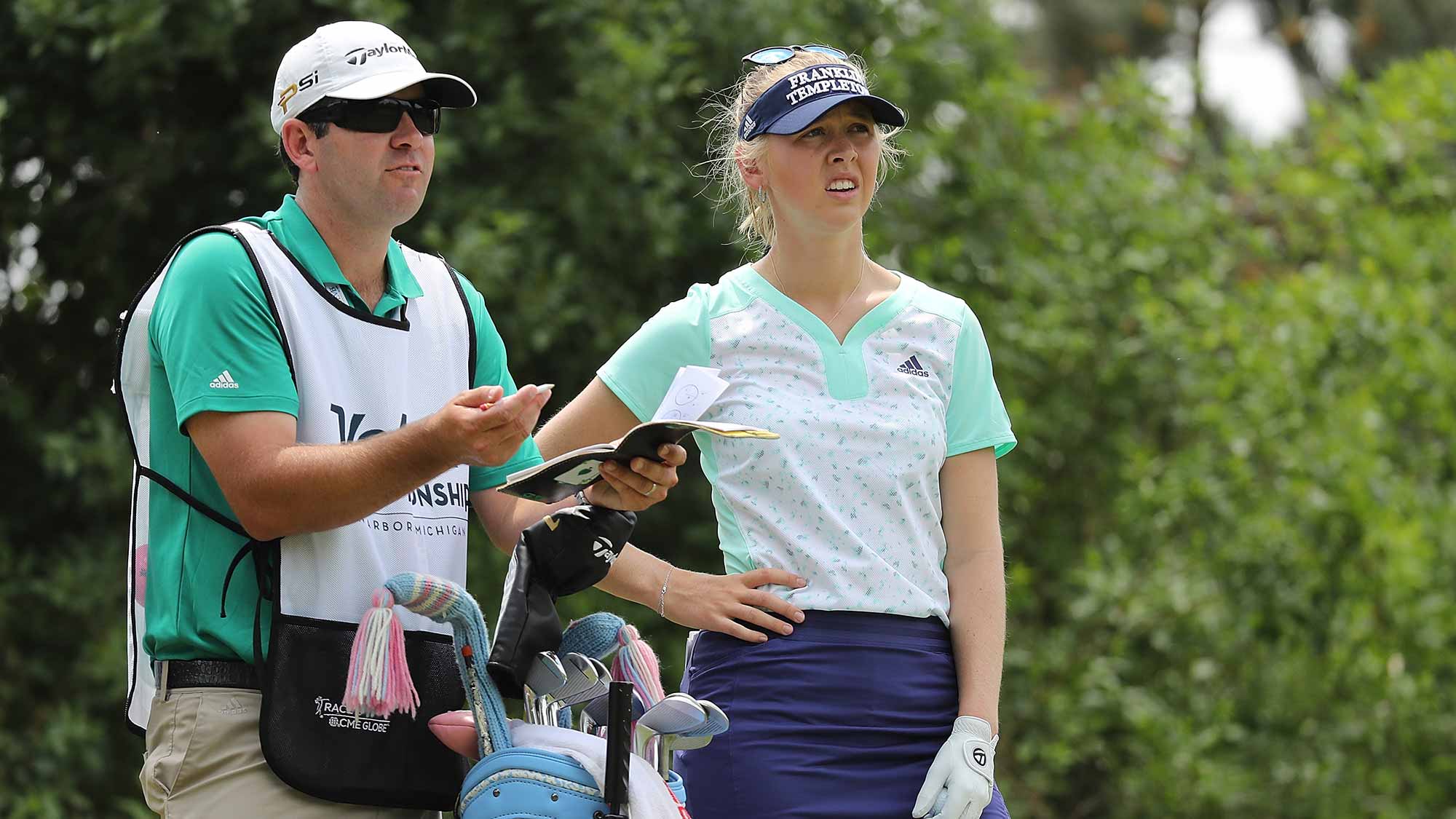 Jessica Korda from the United States talks with her caddie on the third hole during the third round of the LPGA Volvik Championship