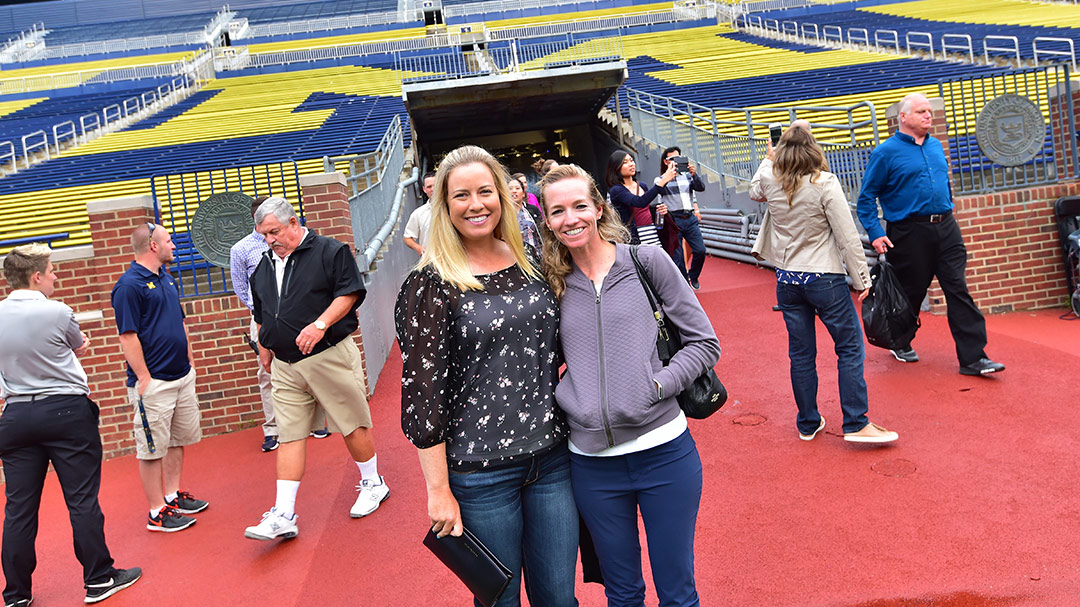 Brittany Lincicome (left) and Kris Tamulis pose for a photo during the LPGA Volvik Championship Pro Am Party at Michigan Stadium