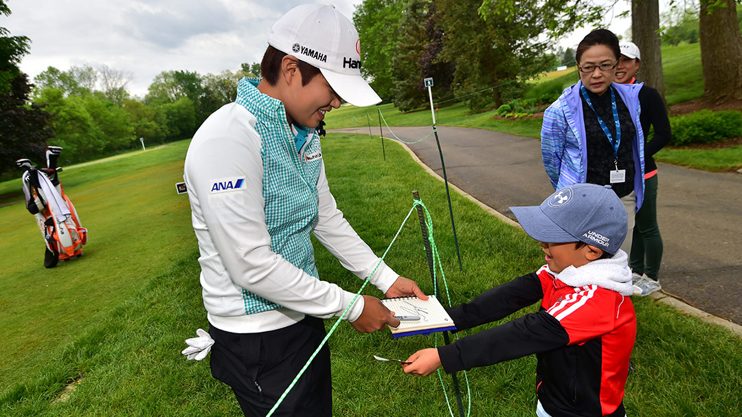 Haru Nomura signs an autograph during the LPGA Volvik Championship ProAm