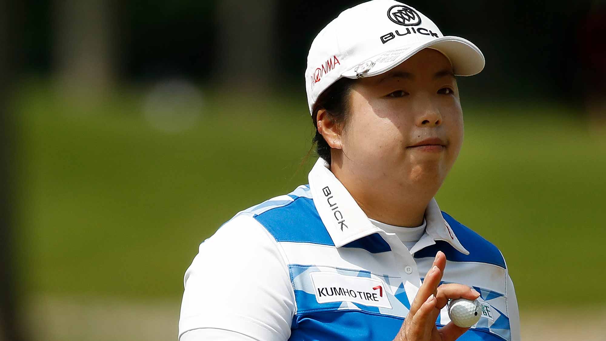 Shanshan Feng of China waves to fans after a par on the seventh hole during the final round of the LPGA Volvik Championship on May 28, 2017 at Travis Pointe Country Club Ann Arbor, Michigan