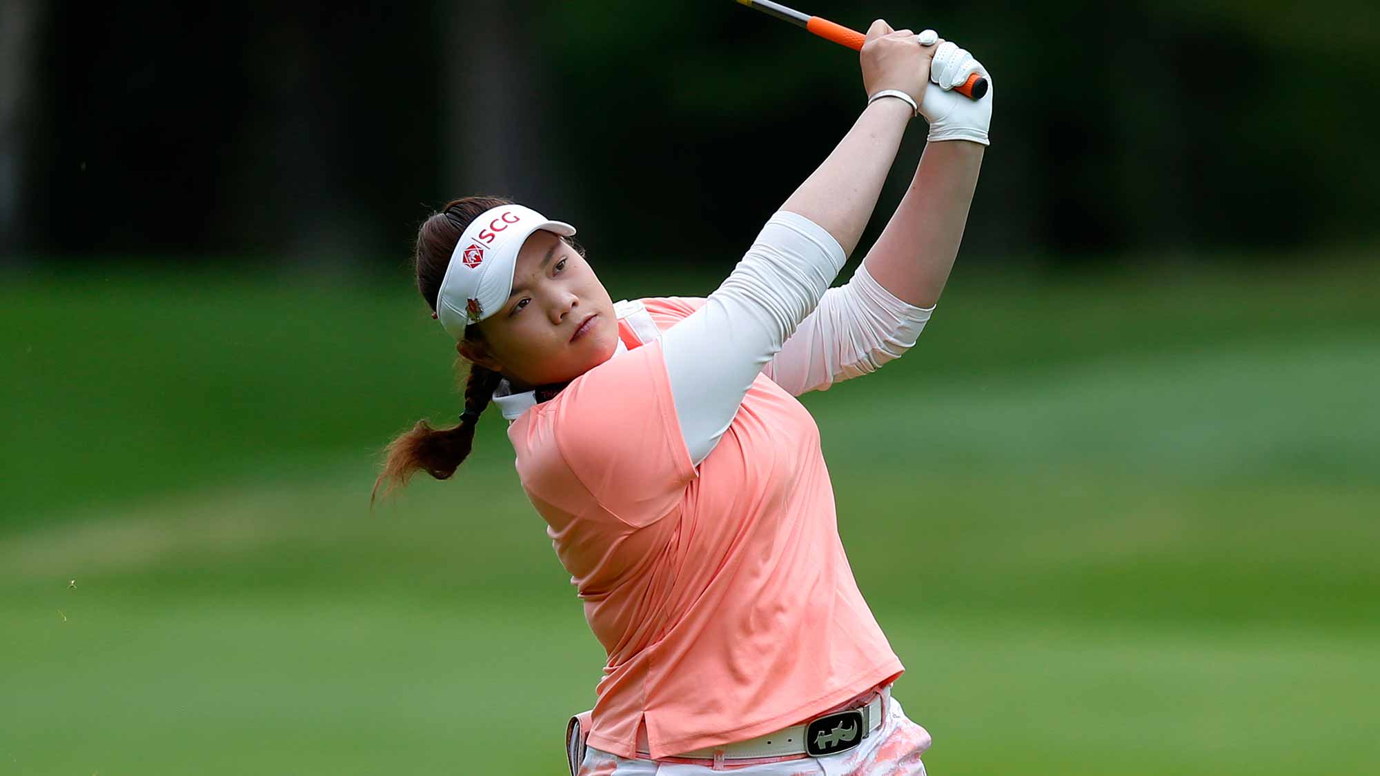 Ariya Jutanugarn of Thailand hits to the green on the 1st hole during the third round of the Canadian Pacific Women's Open at Priddis Greens Golf and Country Club 