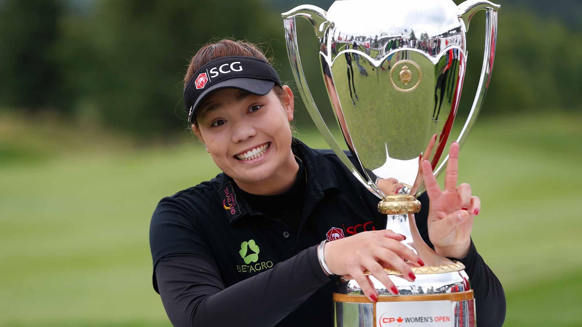 Ariya Jutanugarn of Thailand poses with the Canadian Pacific Women's Open trophy after she won the event at Priddis Greens Golf and Country Club