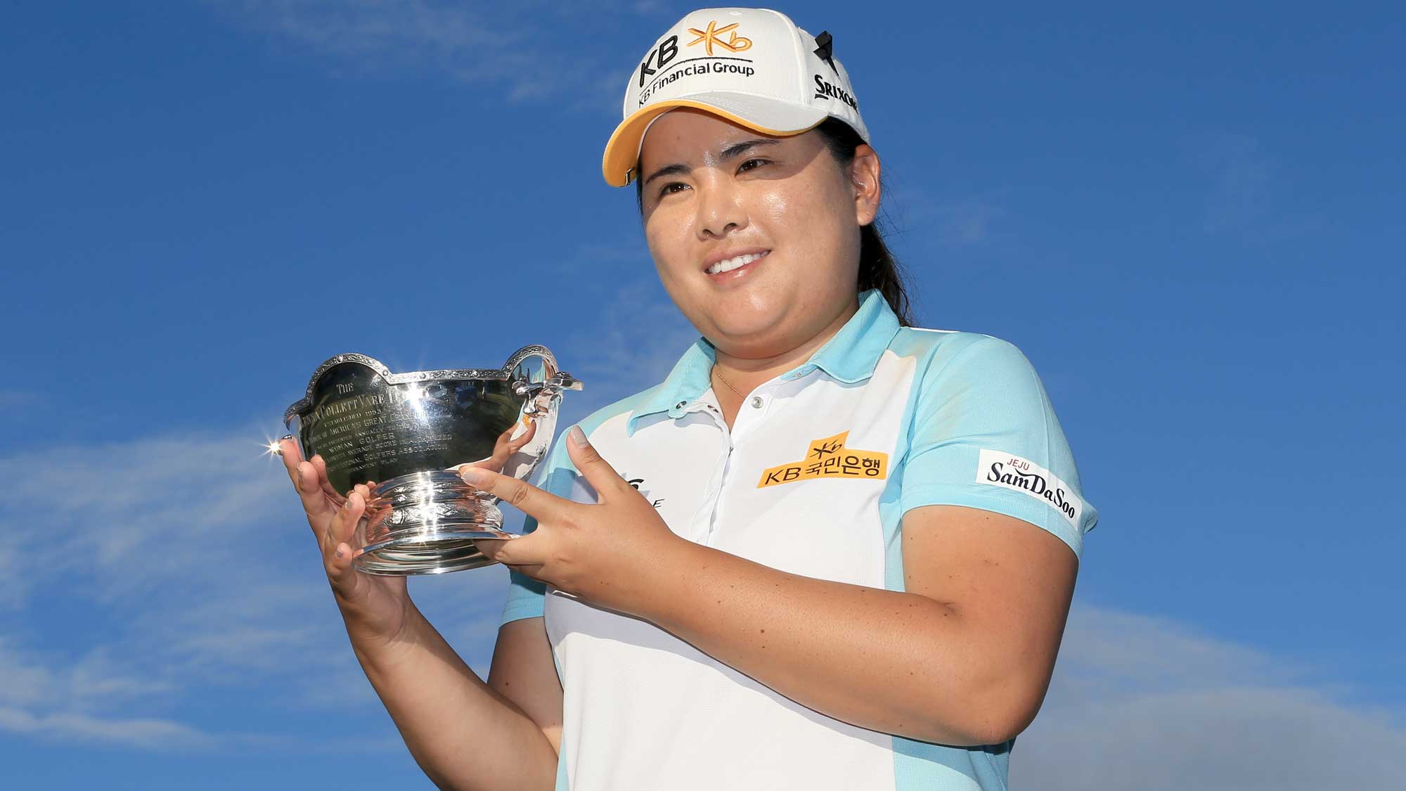 Inbee Park of South Korea poses with the Vare trophy during the final round of the CME Group Tour Championship at Tiburon Golf Club