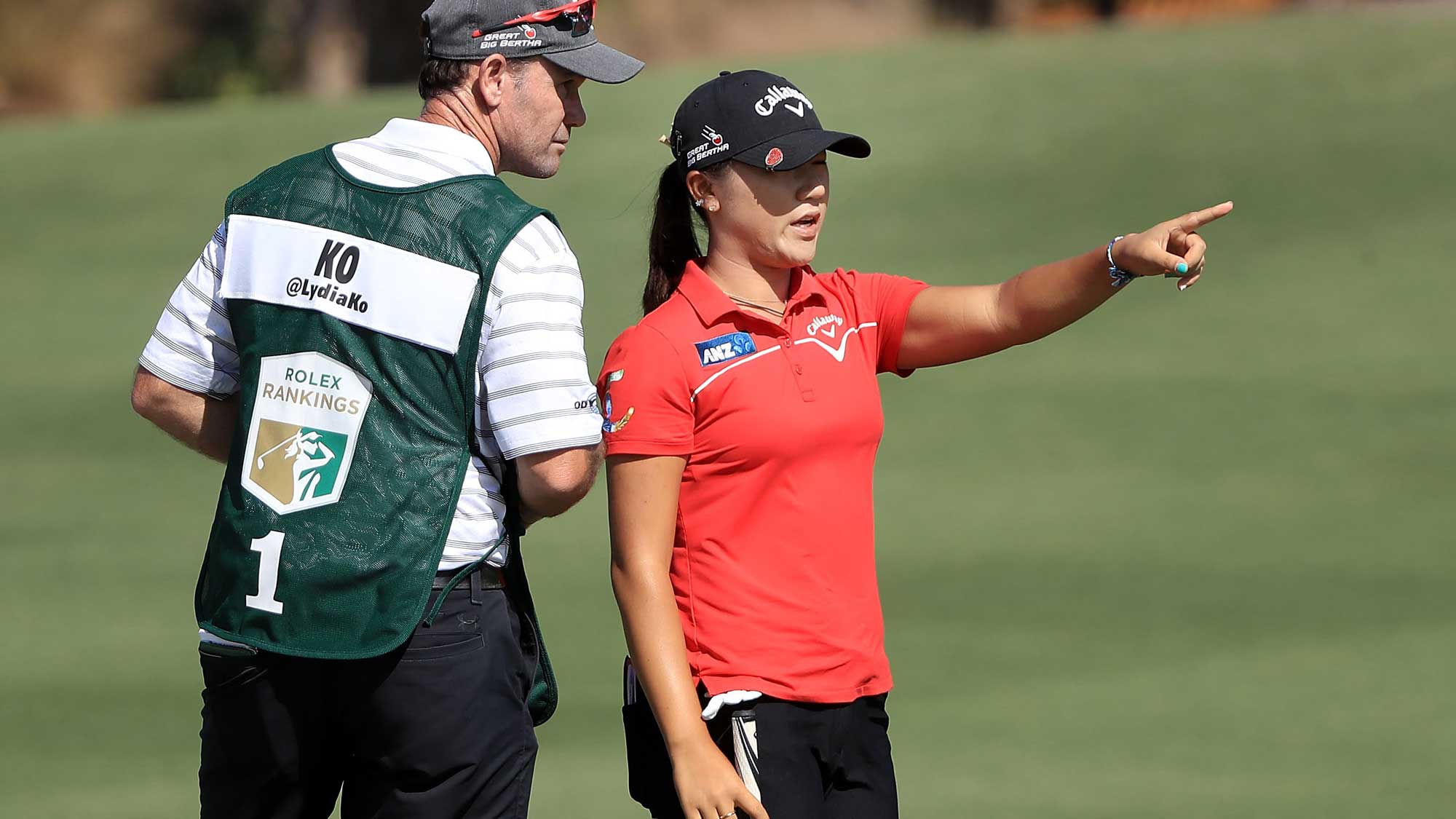 Lydia Ko of New Zealand talks with her caddie on the eighth hole during the second round of the CME Group Tour Championship at Tiburon Golf Club