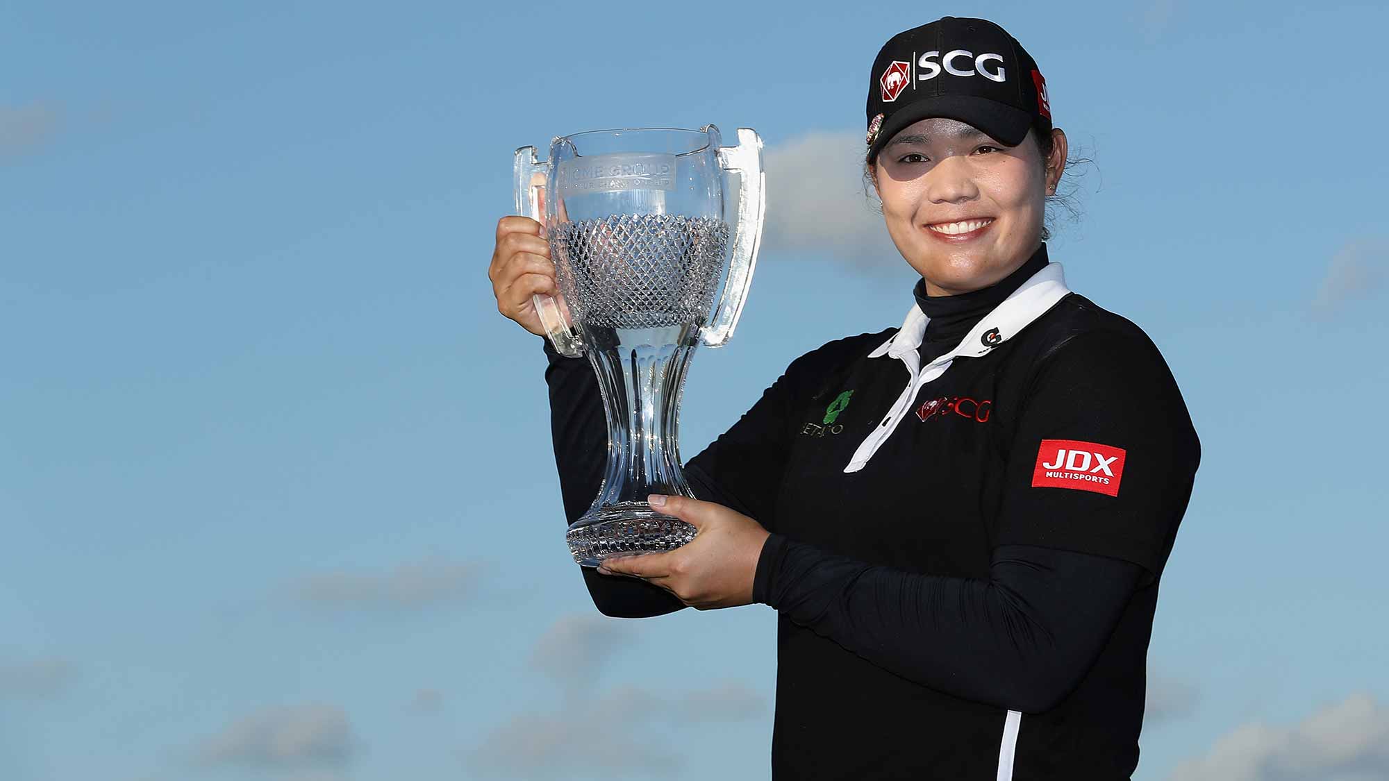 Ariya Jutanugarn of Thailand poses with the CME Group Tour Championship trophy after the final round of the CME Group Tour Championship