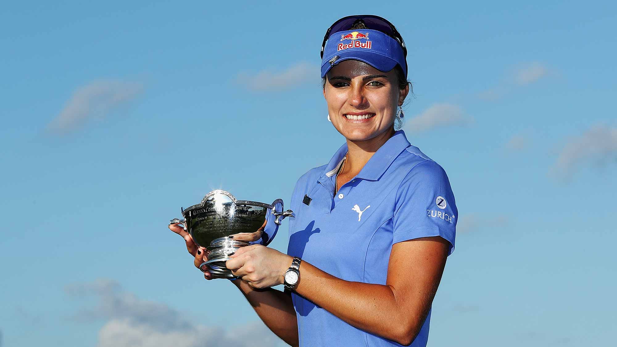Lexi Thompson of the United States poses with the Vare Trophy after the final round of the CME Group Tour Championship