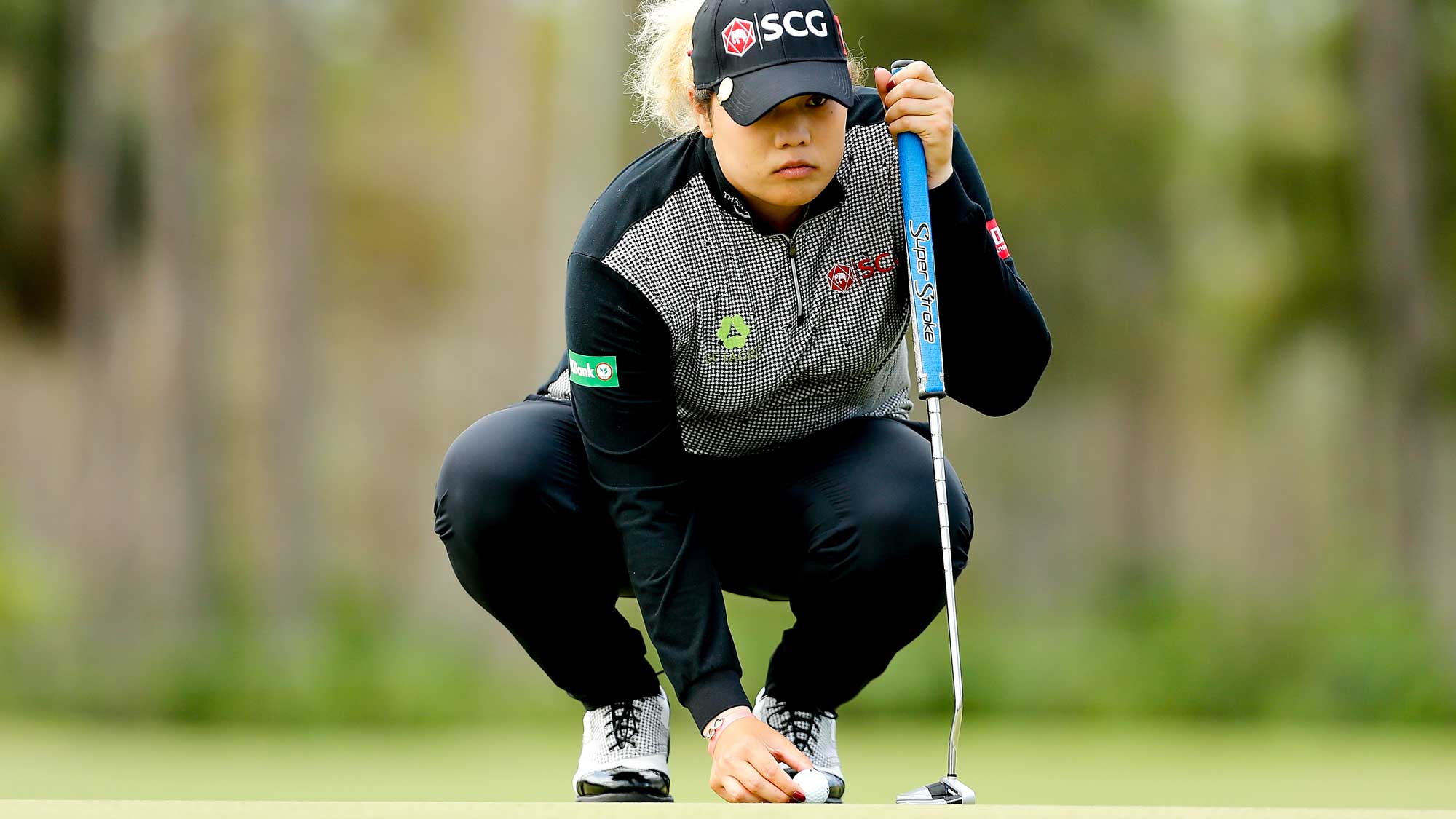 Ariya Jutanugarn of Thailand looks over a putt on the first green during the final round of the LPGA CME Group Tour Championship
