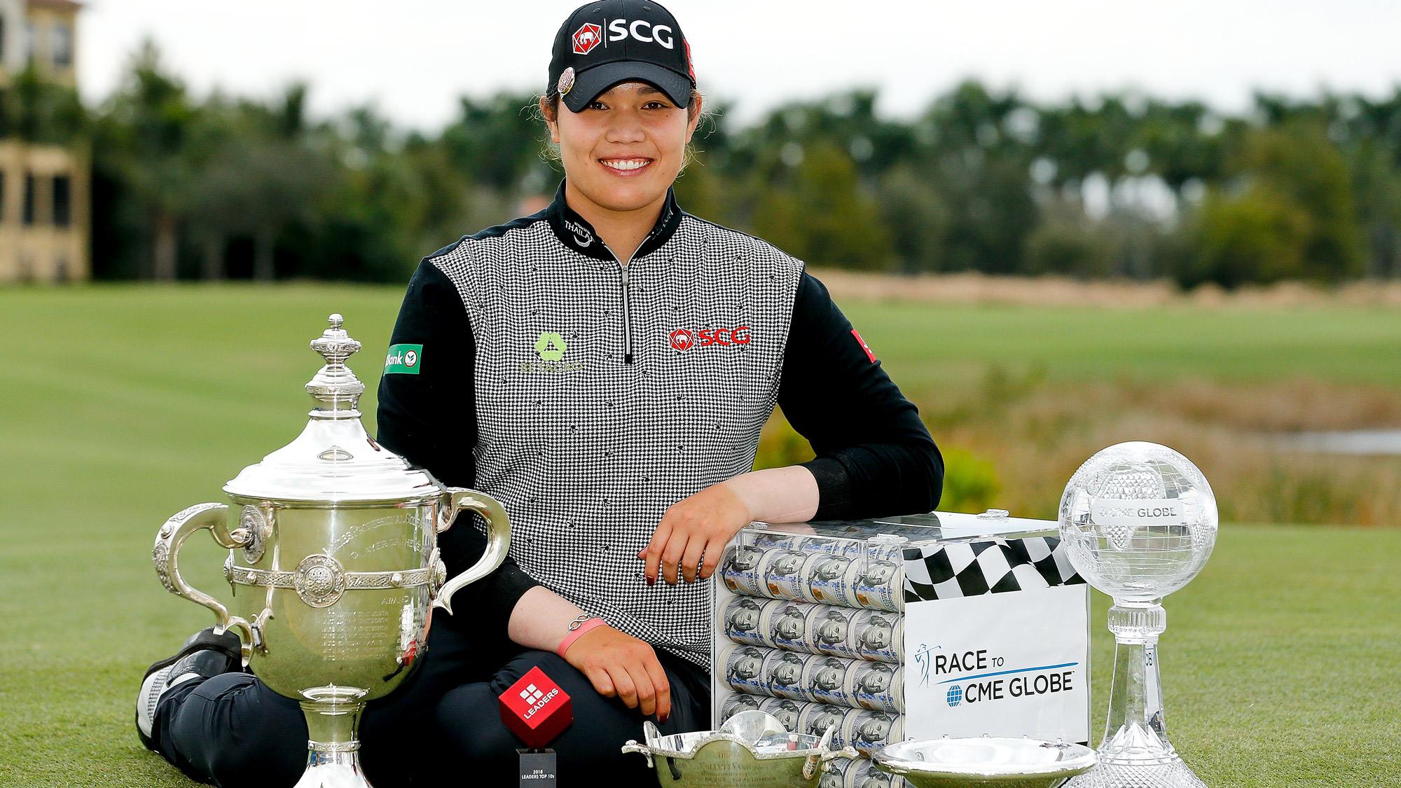 Ariya Jutanugarn of Thailand poses for a photo with (left to right) the Rolex Player of the Year trophy, Leaders Top 10 Competition Trophy, Vare trophy, Rolex Annika Major award and the Race to the CME Globe trophy after the final round of the LPGA CME Group Tour Championship
