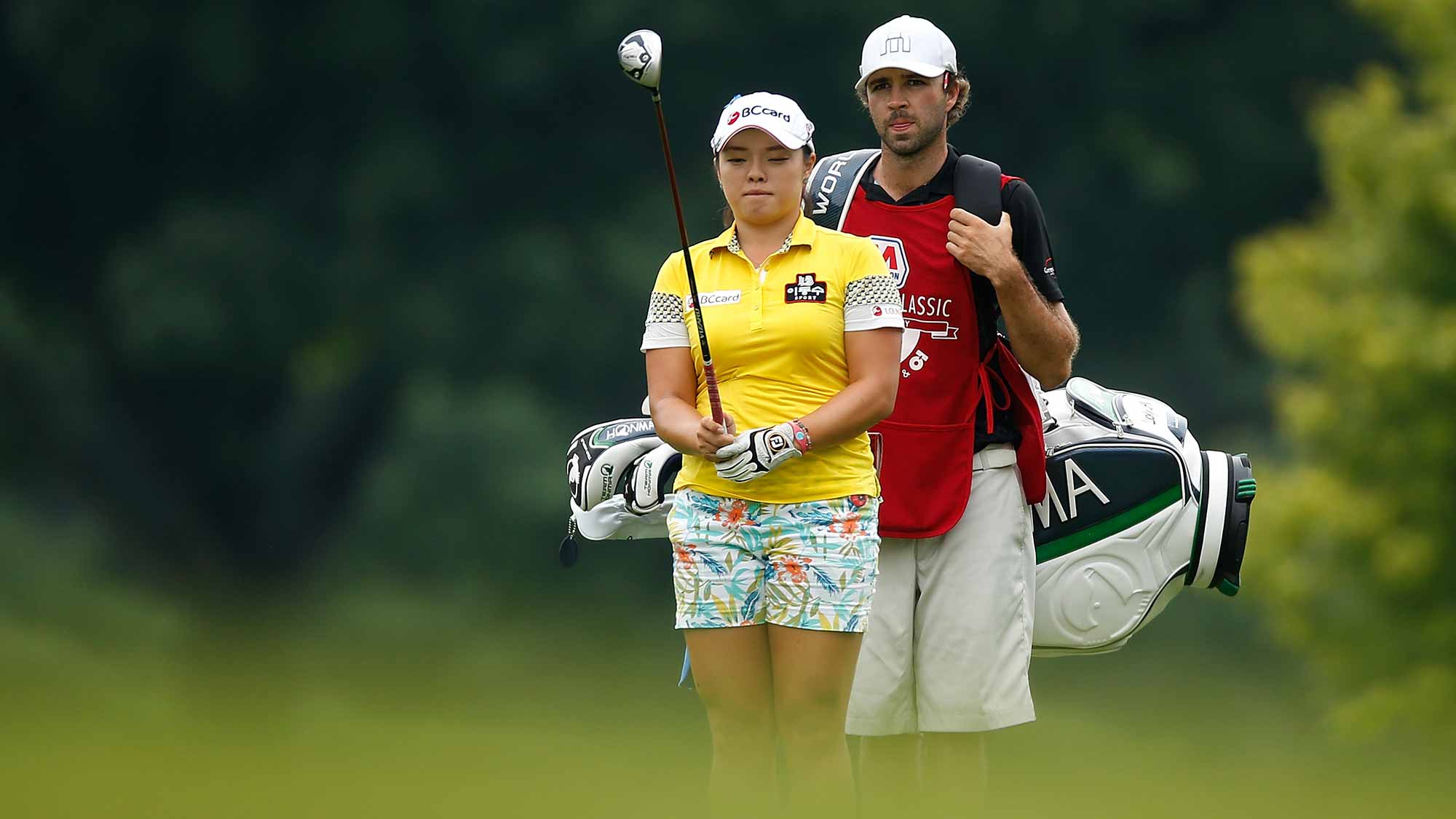 Ha Na Jang of South Korea lines up shot in the 18th fairway with her caddie David Stone during the second round of the Marathon Classic presented by Owens Corning and O-I at Highland Meadows Golf Club