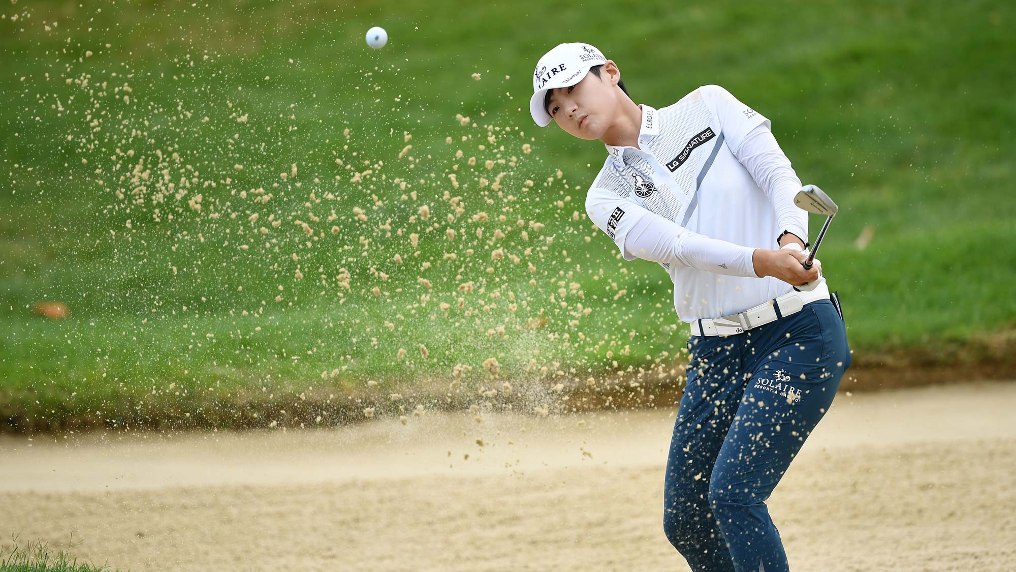 Sung Hyun Park of Korea plays her bunker shot on the ninth hole during day 3 of the Evian Championship 