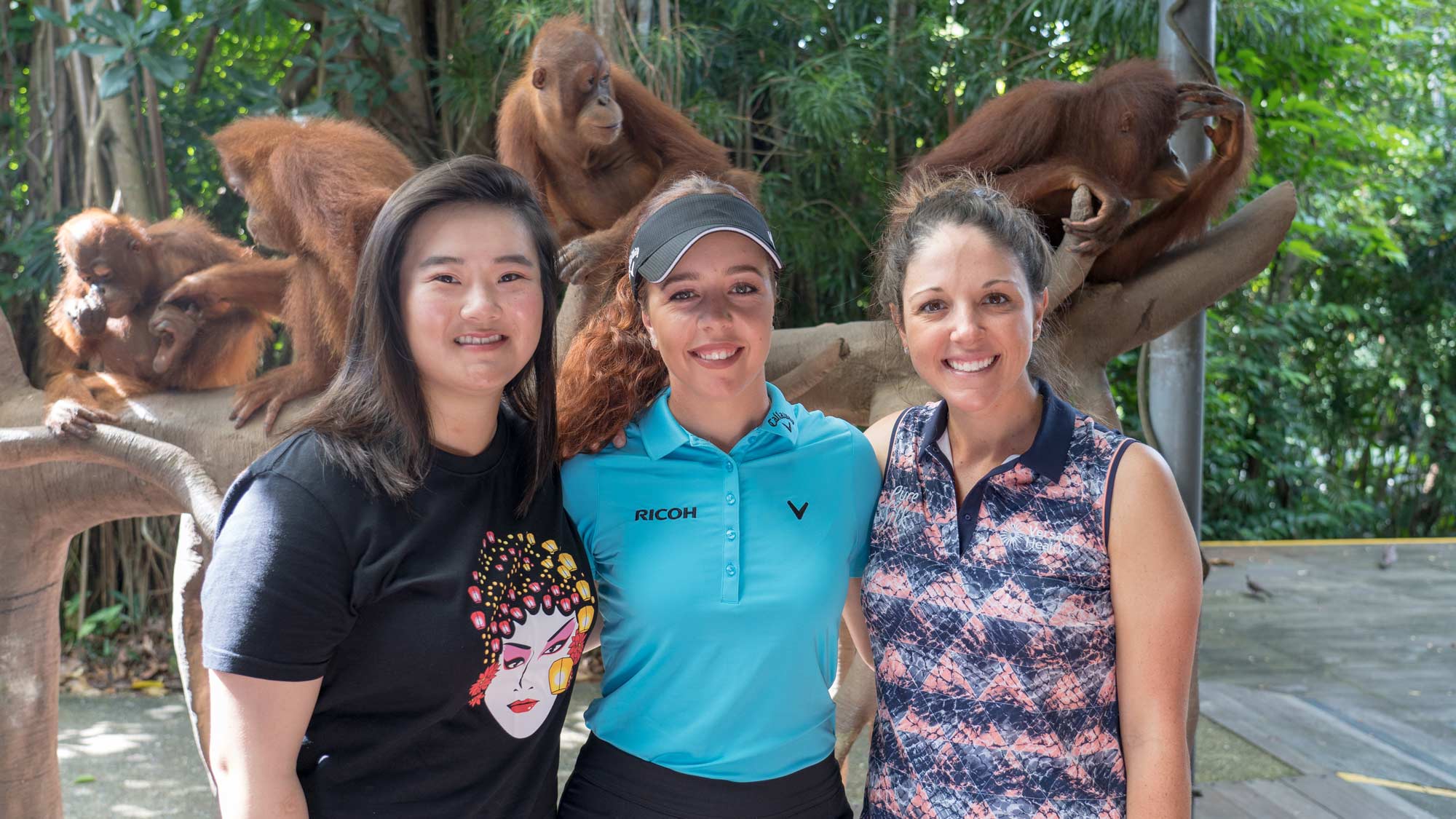 Angel Yin, Georgia Hall and Emma Talley visit with orangutans at the zoo after their opening practice round February 26th, 2019.