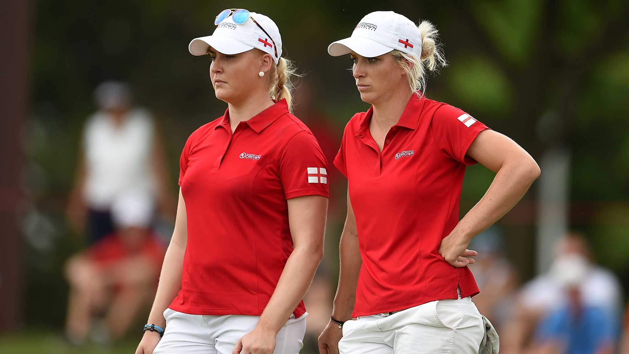 Charley Hull and Melissa Reid of England wait on the 16th green during the four-ball session of the 2016 UL International Crown