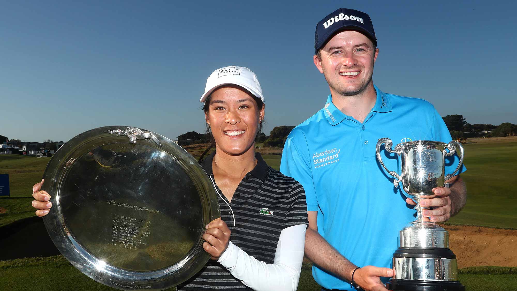Celine Boutier of France and David Law of Scotland pose with their winner's trophies during Day four of the ISPS Handa Vic Open at 13th Beach Golf Club on February 10, 2019 in Geelong, Australia