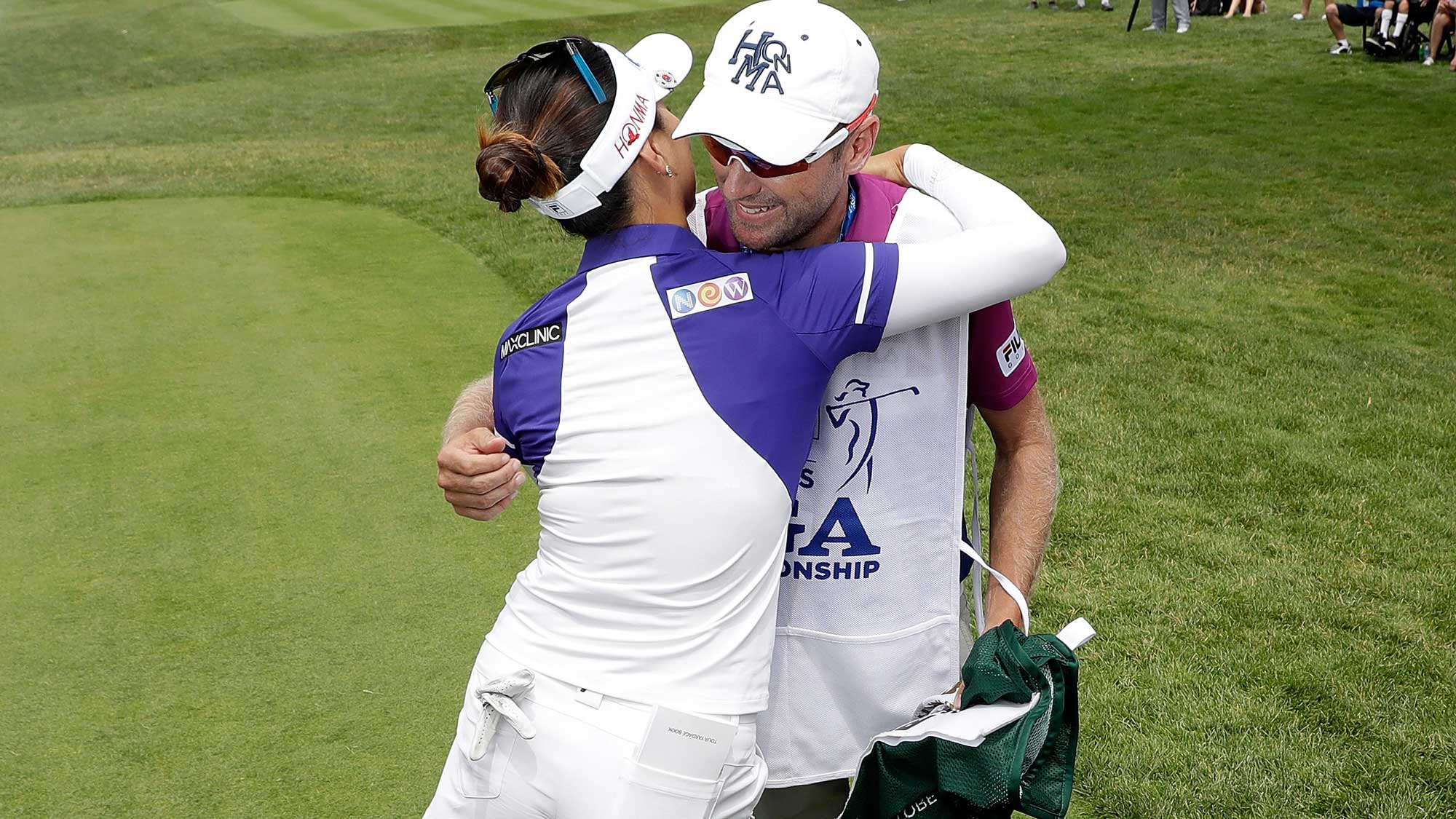So Yeon Ryu of South Korea hugs her caddie, Tom Watson, after giving him a caddie bib signifying her #1 world ranking during the first round of the 2017 KPMG PGA Championship