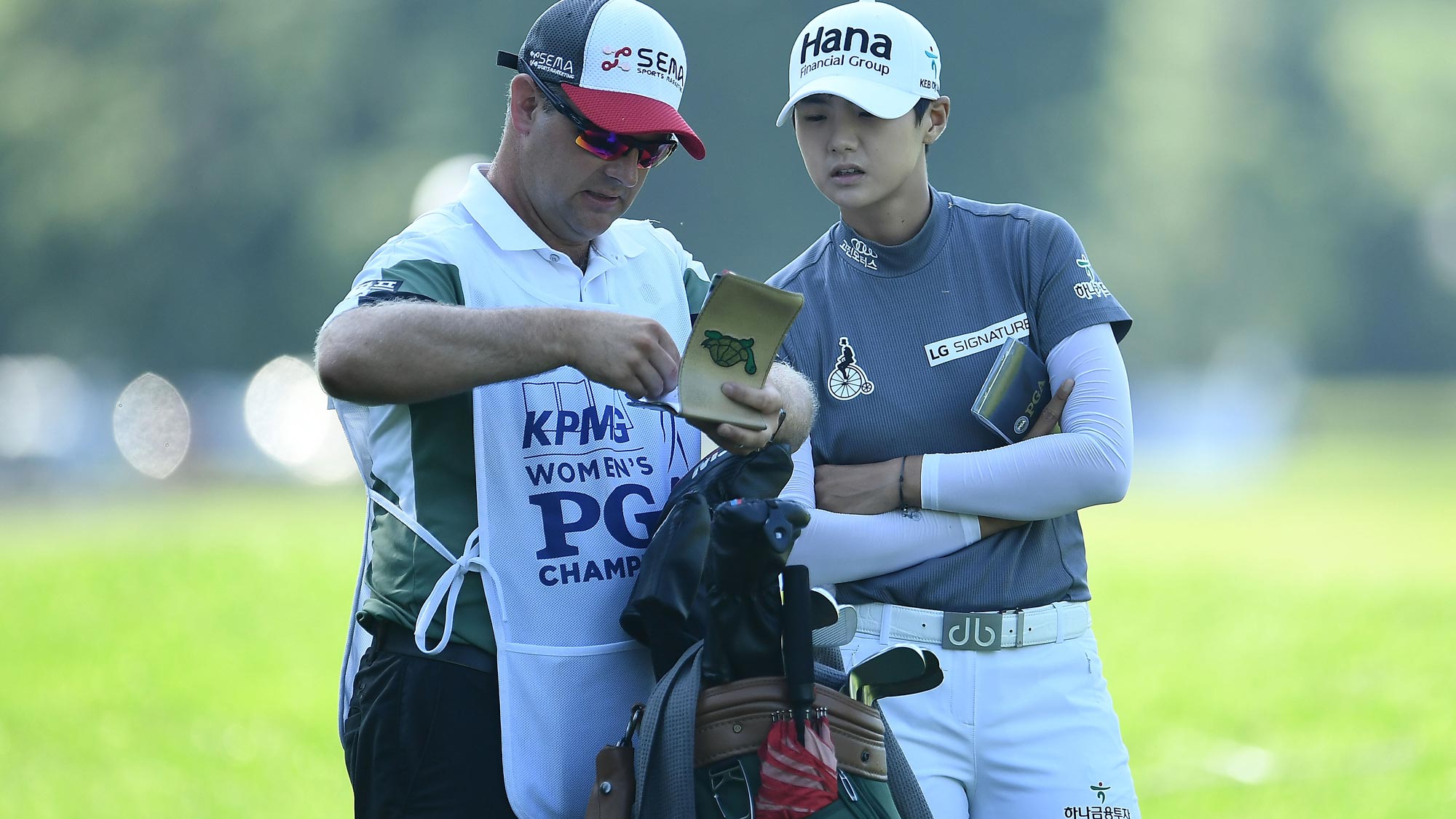 Sung Hyun Park of Korea speaks with her caddie on the 10th hole during the second round of the KPMG Women's PGA Championship