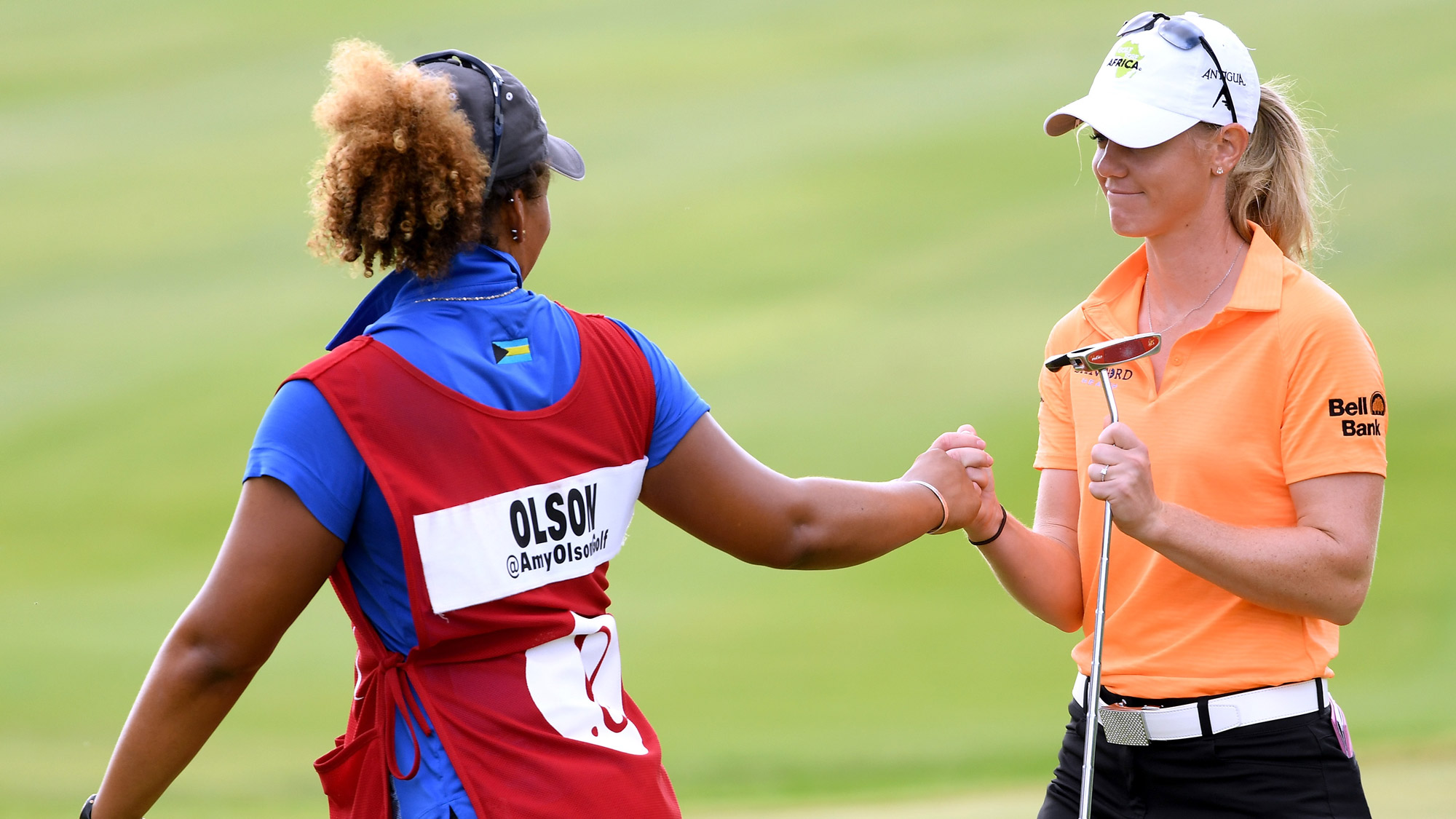 Amy Olson Celebrates with Her Caddy at LOTTE Championship 