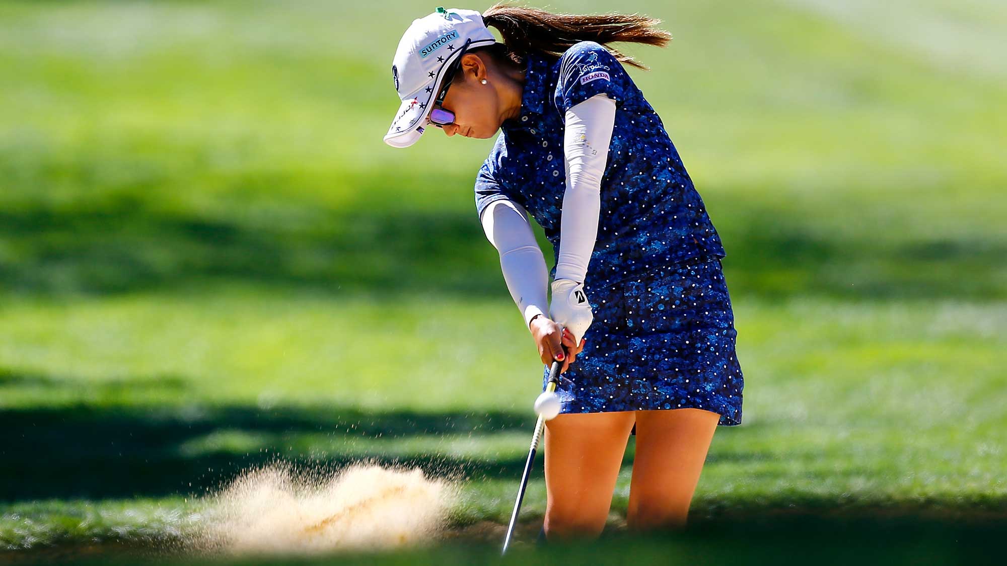 Ai Miyazato of Japan hits out of a bunker on the 9th hole during the third round of the LPGA Cambia Portland Classic