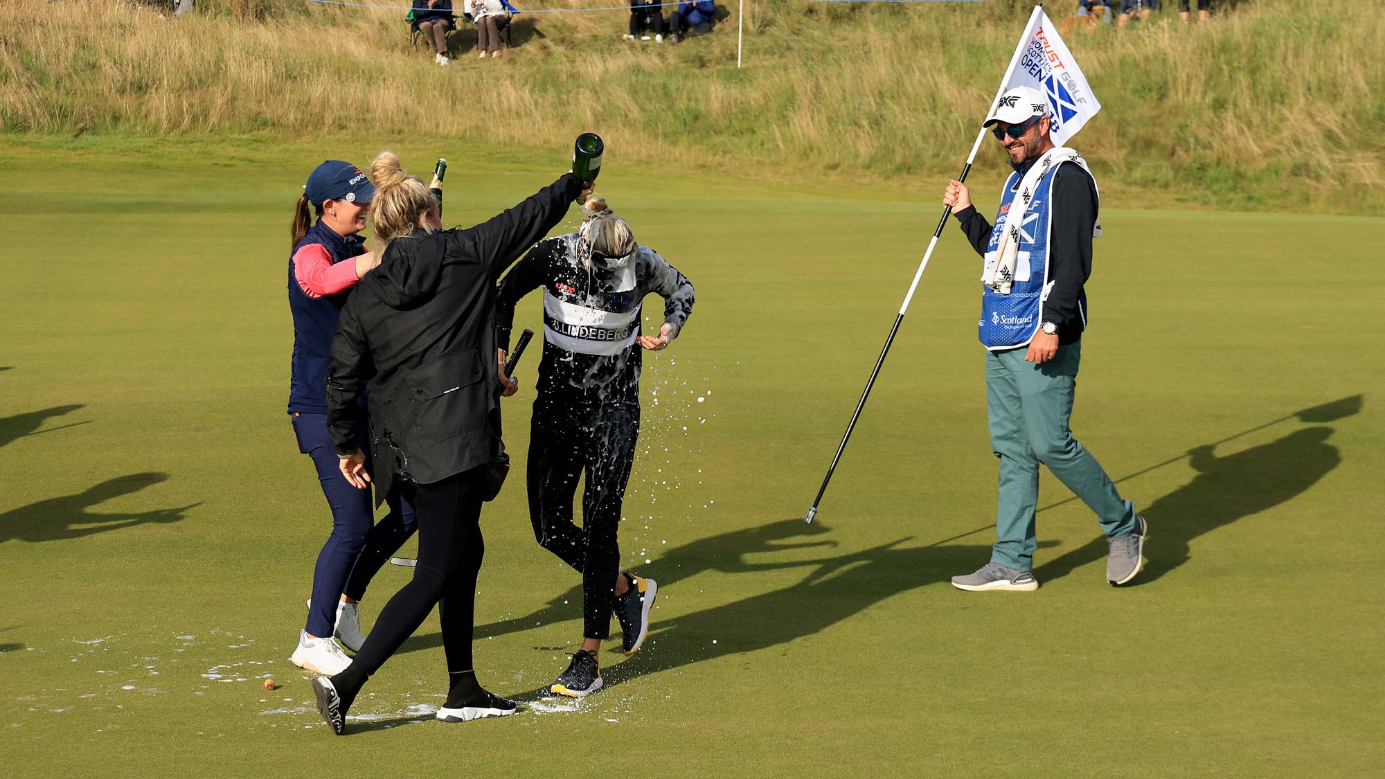 Ryann O'Toole of The United States is doused in champagne by friends after sealing her maiden LPGA victory by three shots on the 18th hole during the final round of the Trust Golf Women's Scottish Open