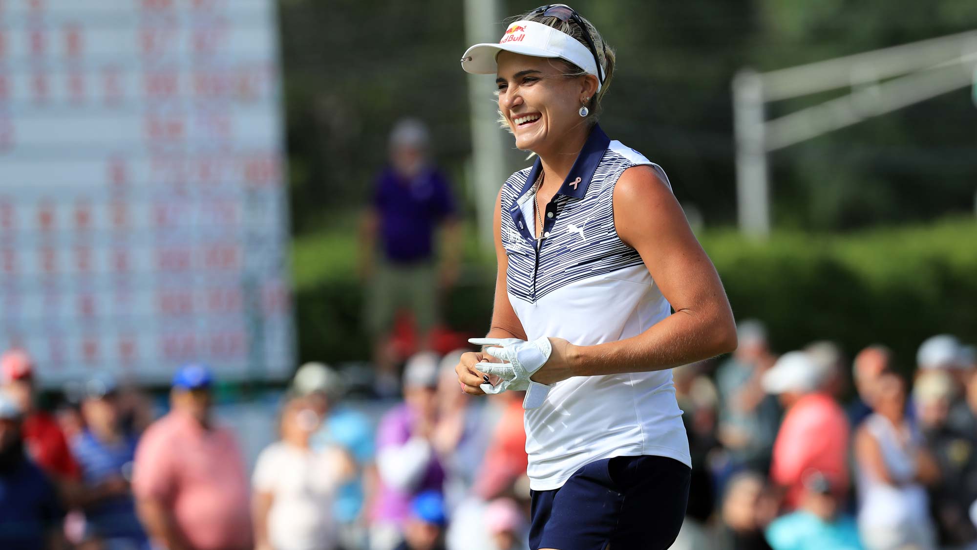 Lexi Thompson smiles as she walks off the green after making a putt for eagle on the 18th hole during the final round of the ShopRite LPGA Classic presented by Acer