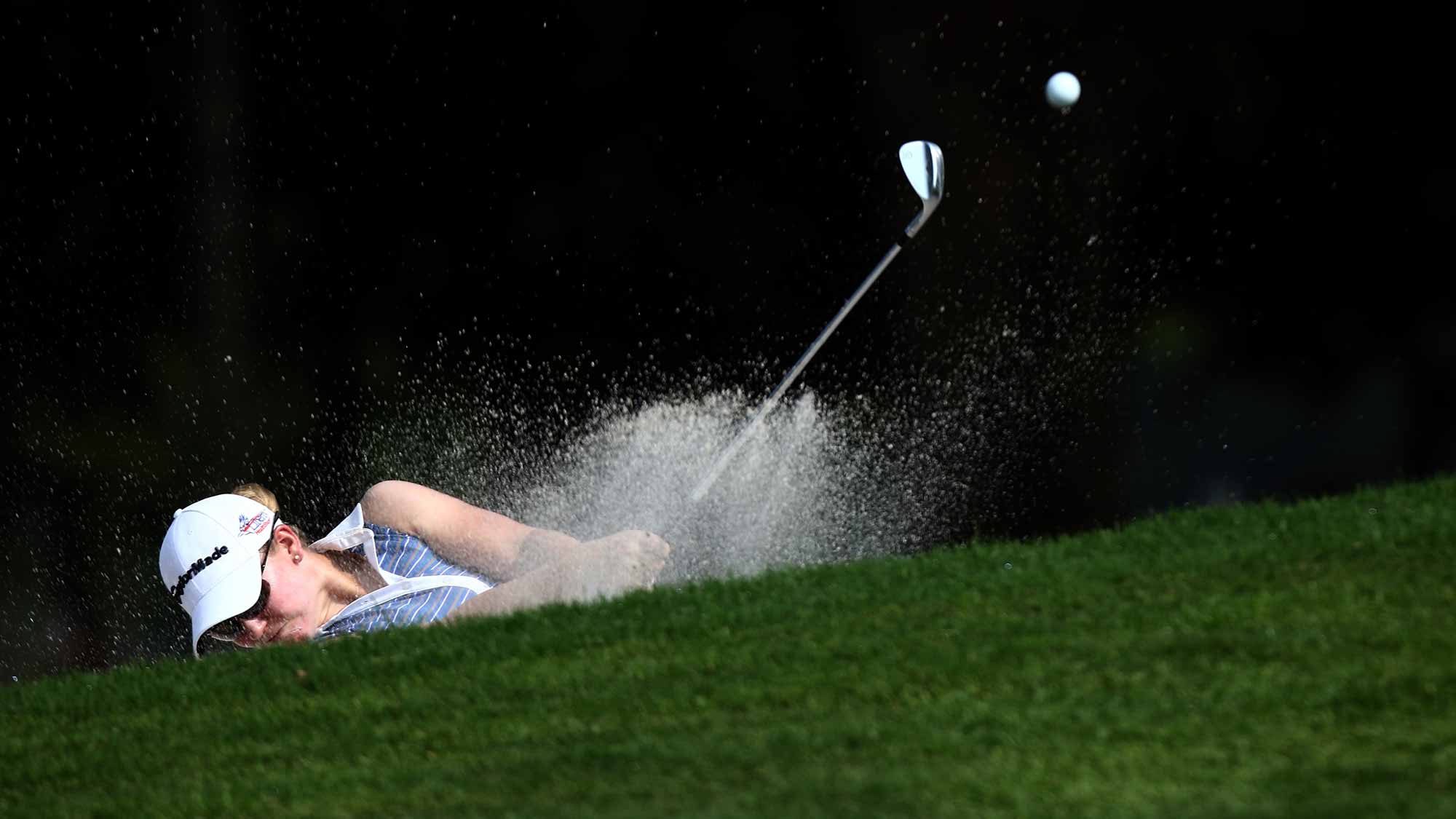 Austin Ernst of USA plays her bunker shot on the 6th hole during round one of the Sime Darby LPGA Tour at Kuala Lumpur Golf & Country Club