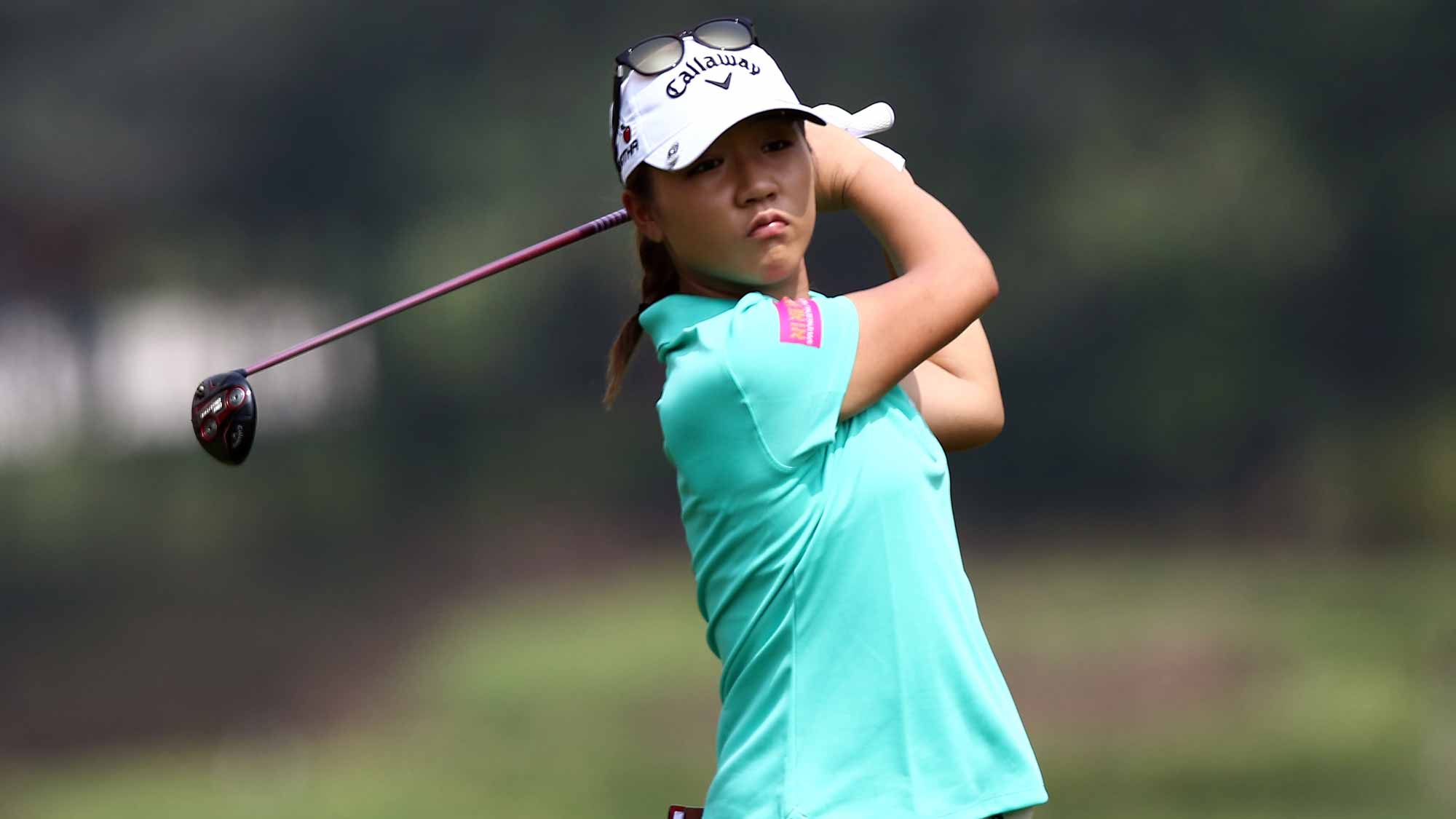 Lydia Ko of New Zealand plays her 2nd shot on the 4th hole during round one of the Sime Darby LPGA Tour at Kuala Lumpur Golf & Country Club