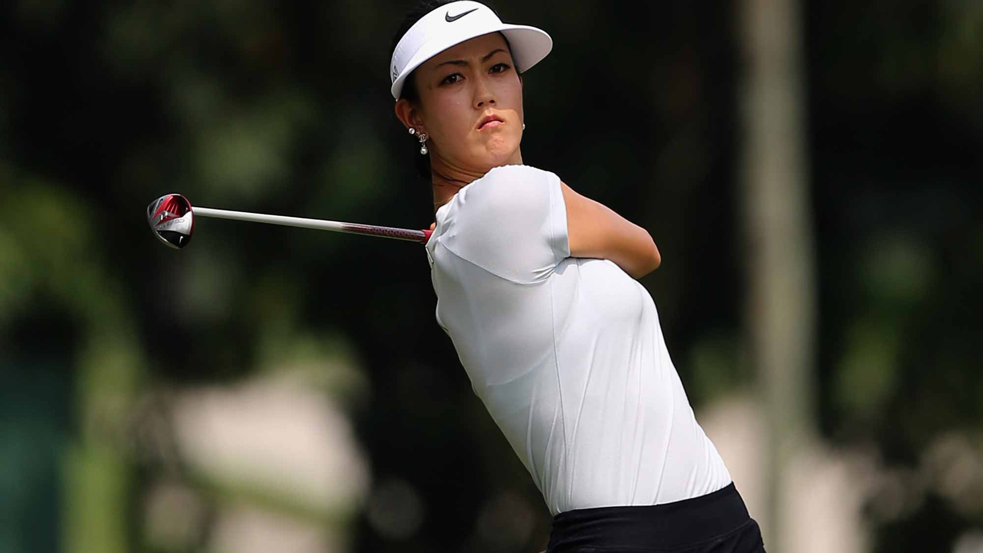 Michelle Wie of USA plays her 2nd shot on the 6th hole during round one of the Sime Darby LPGA Tour at Kuala Lumpur Golf & Country Club 