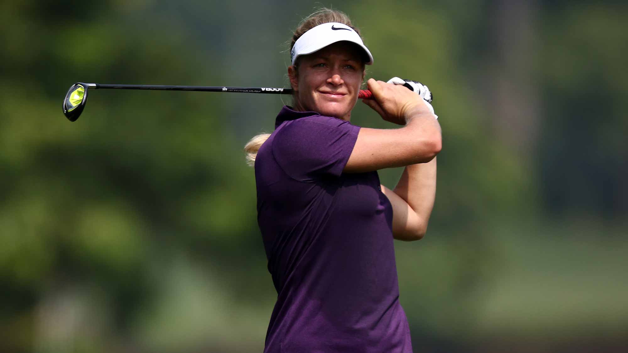 Suzann Pettersen of Norway watches her 2nd shot on the 6th hole during round one of the Sime Darby LPGA Tour at Kuala Lumpur Golf & Country Club