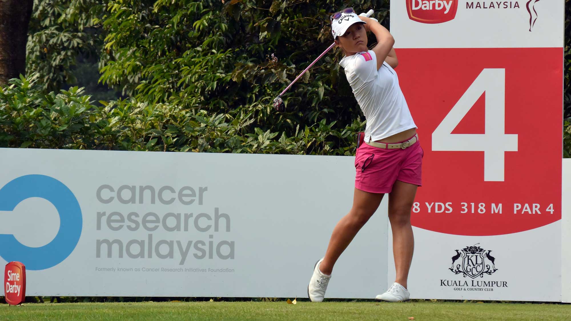 Lydia Ko of New Zealand watches her tee shot on the 4th hole during round three of the Sime Darby LPGA Tour at Kuala Lumpur Golf & Country Club
