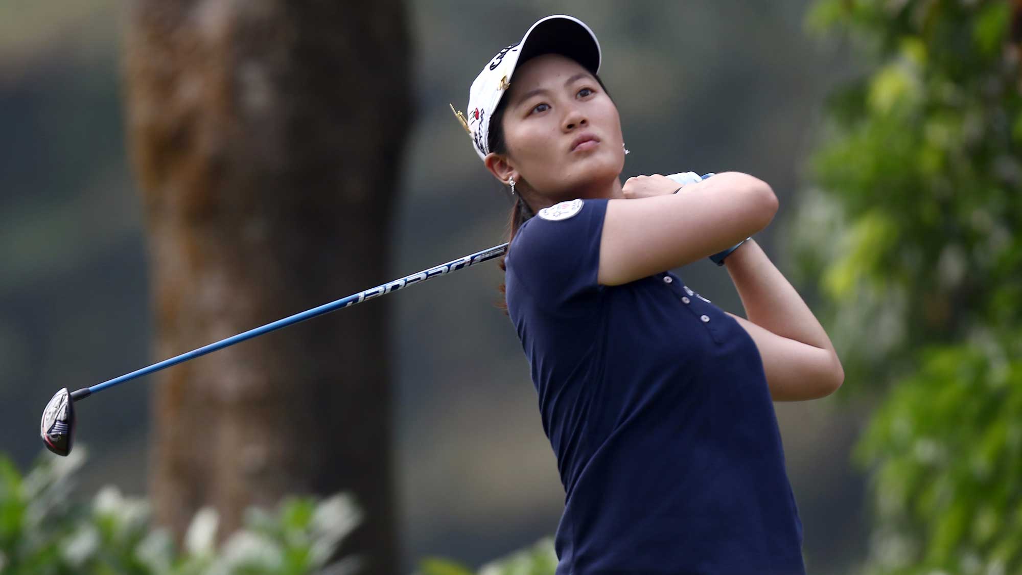 Xi Yu Lin of China watches her tee shot on the 4th hole during round three of the Sime Darby LPGA Tour at Kuala Lumpur Golf & Country Club