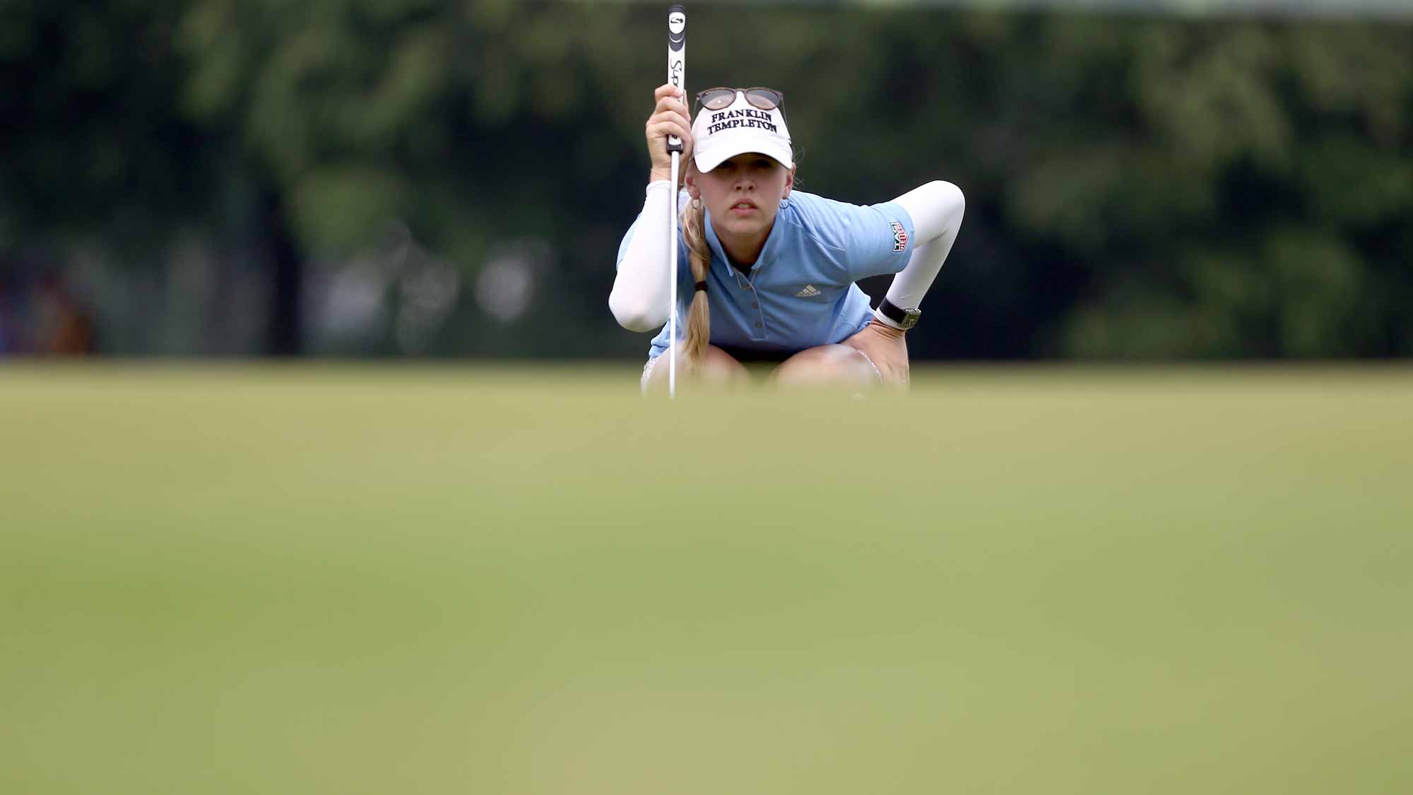 Jessica Korda of USA lines for a putt on the 9th hole during the final round of the Sime Darby LPGA Tour at Kuala Lumpur Golf & Country Club