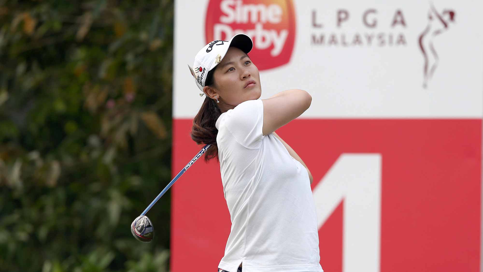 Xi Yu Lin of China watches her tee shot on the 4th hole during the final round of the Sime Darby LPGA Tour at Kuala Lumpur Golf & Country Club