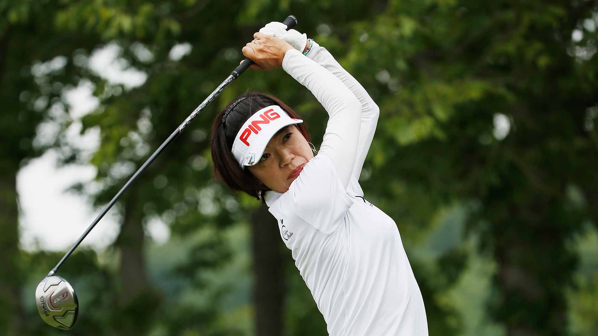 Shiho Oyama of Japan watches her tee shot on the second hole during the final round of the U.S. Women's Open at Lancaster Country Club