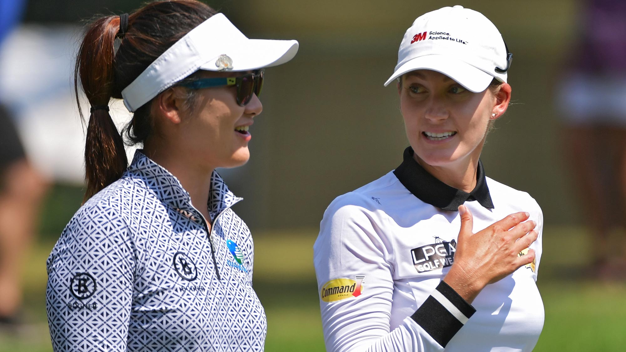 Sarah Jane Smith of Australia speaks with Su Oh of Australia on the first hole during the third round of the 2018 U.S. Women's Open