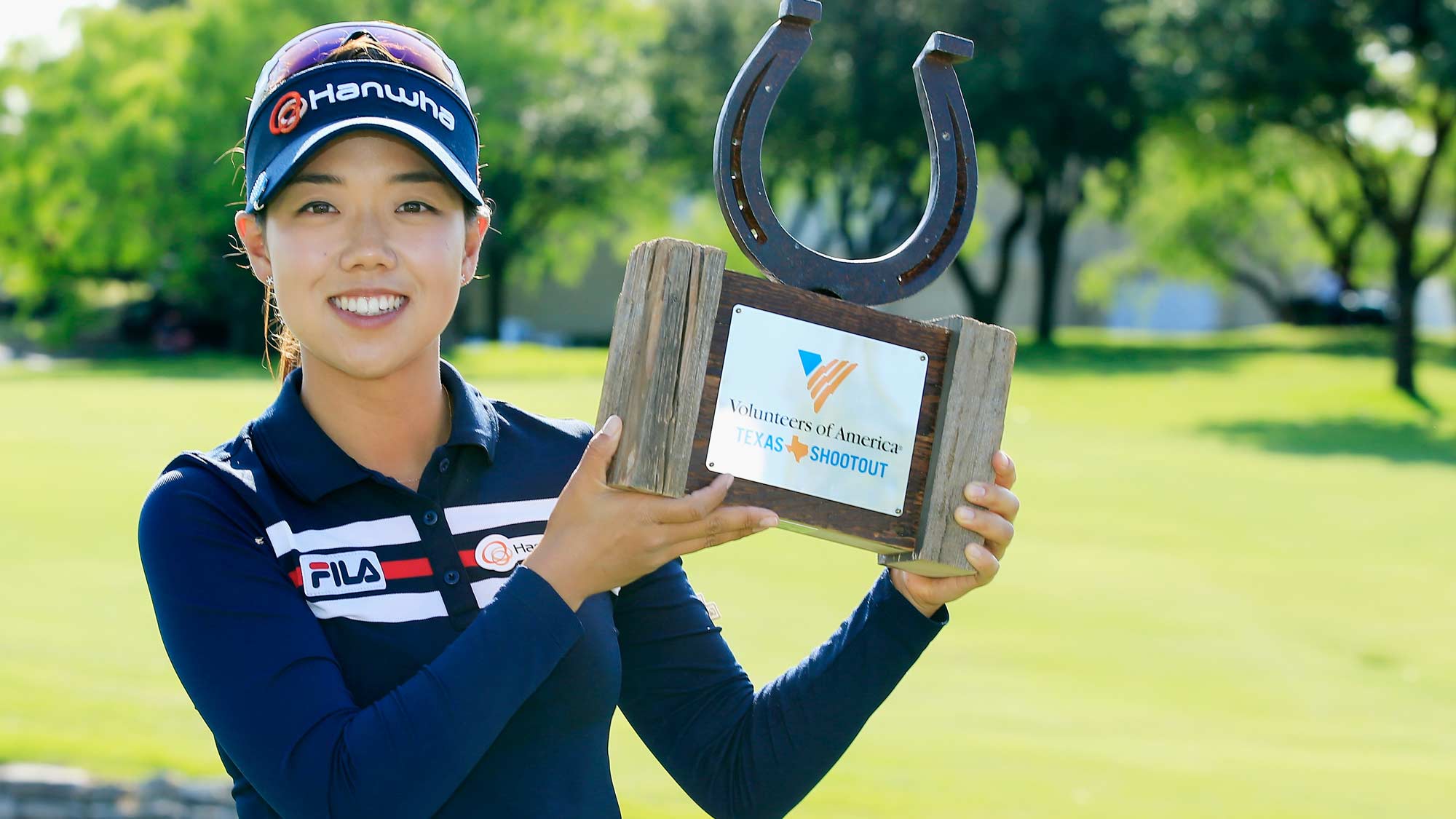 Jenny Shin poses with the trophy after her two-stroke victory at the Volunteers of America Texas Shootout