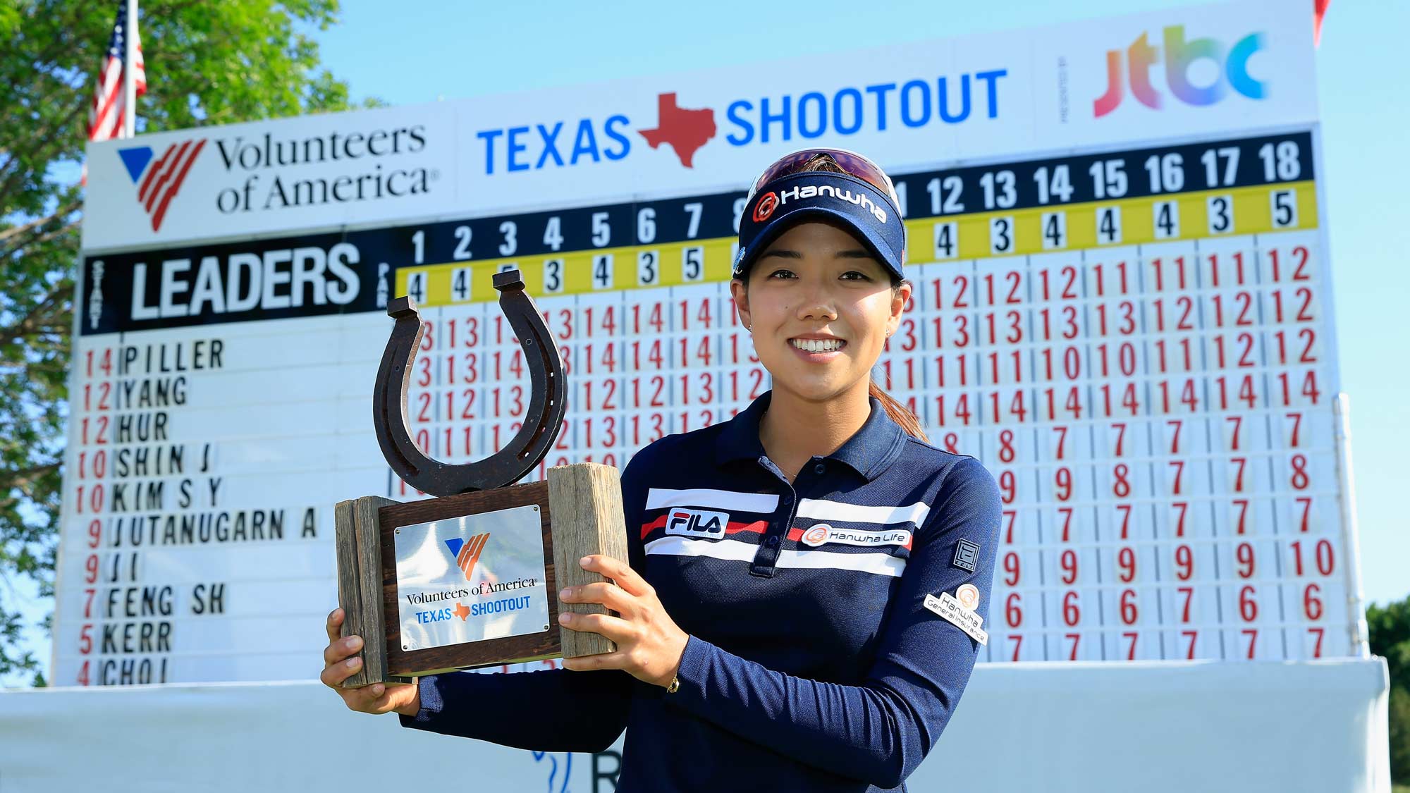 Jenny Shin poses with the trophy after her two-stroke victory at the Volunteers of America Texas Shootout